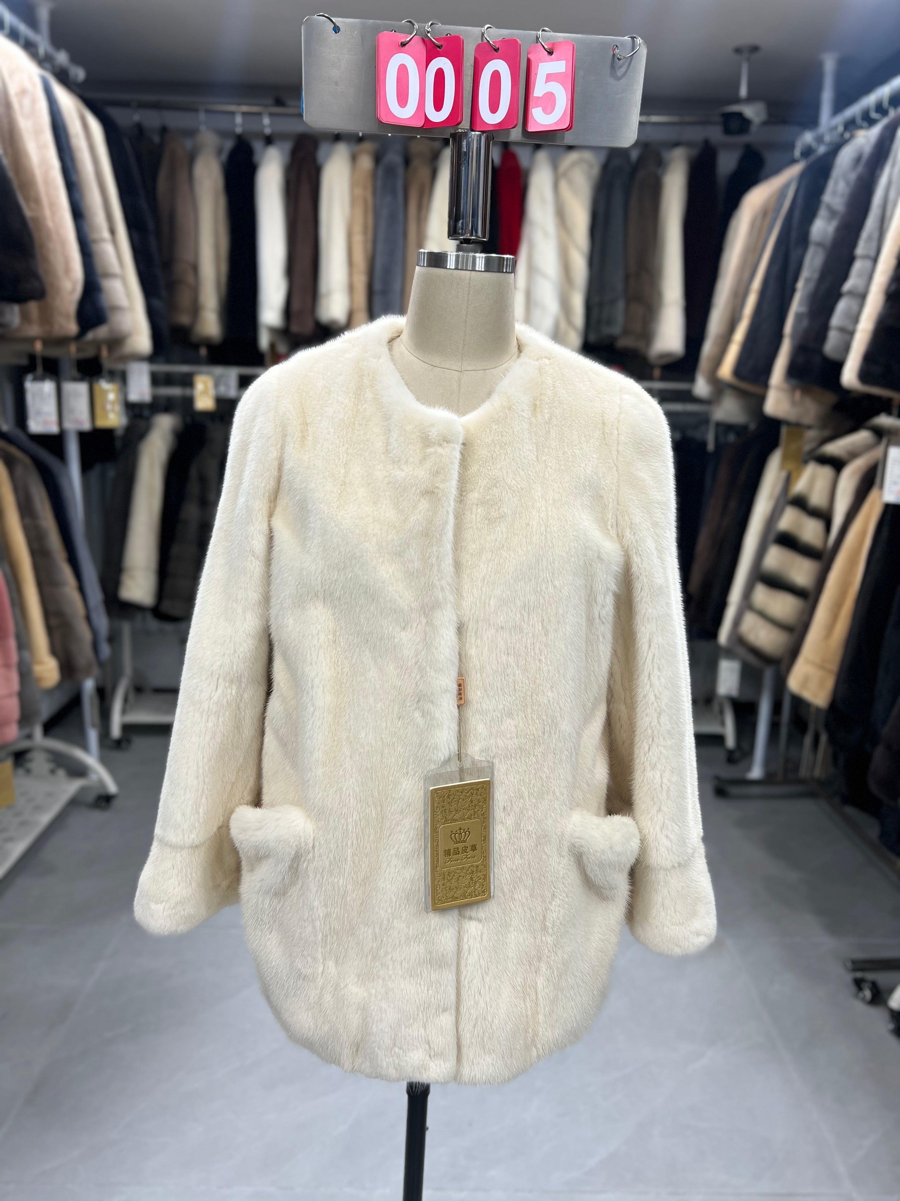 White velvet-finish mink coat with a round-neck design.005