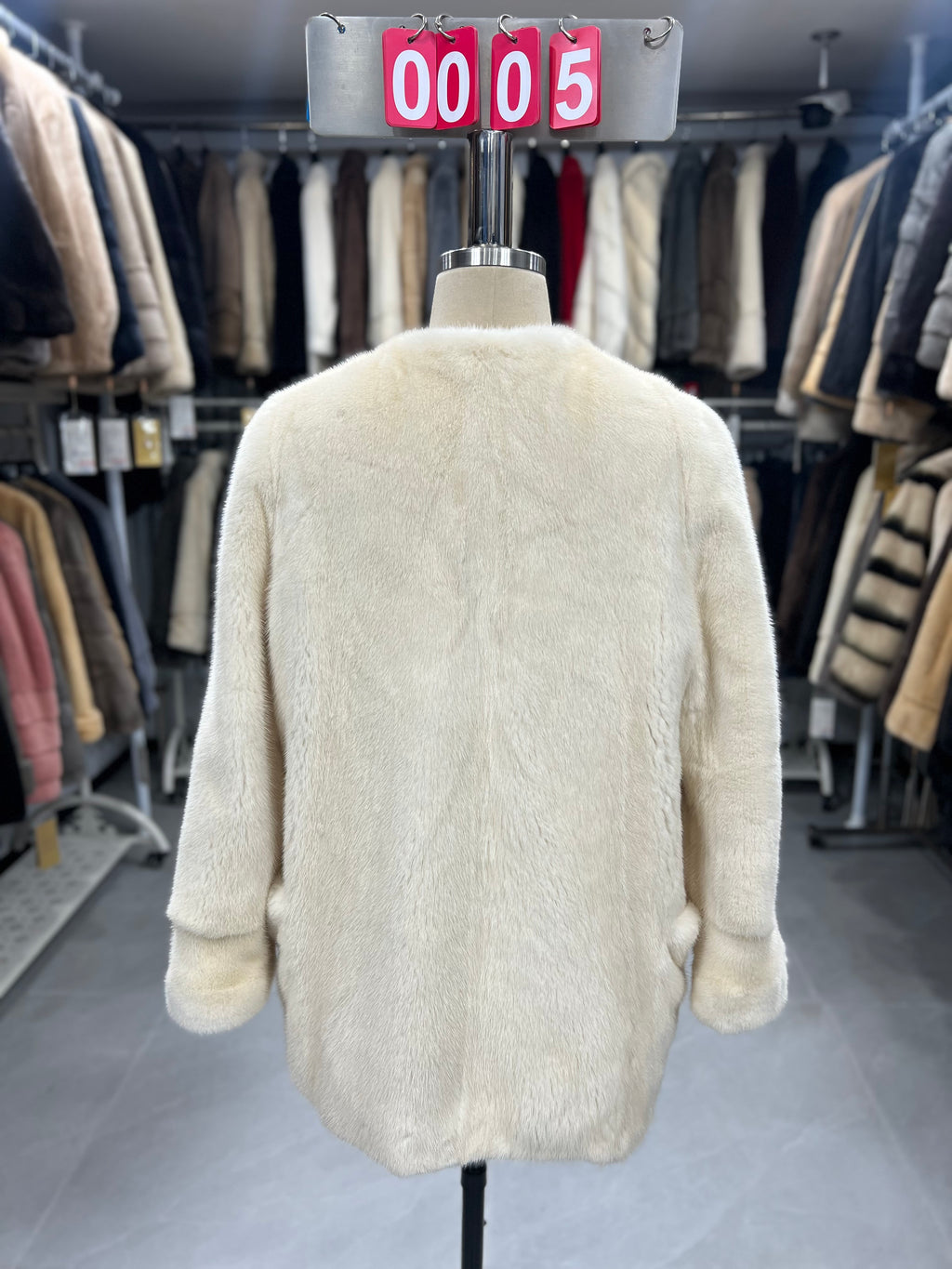 White velvet-finish mink coat with a round-neck design.005