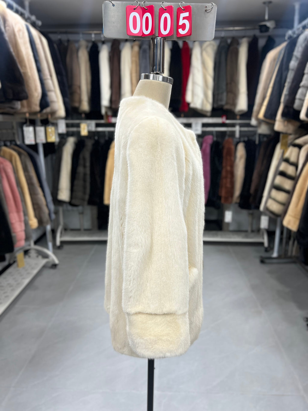 White velvet-finish mink coat with a round-neck design.005