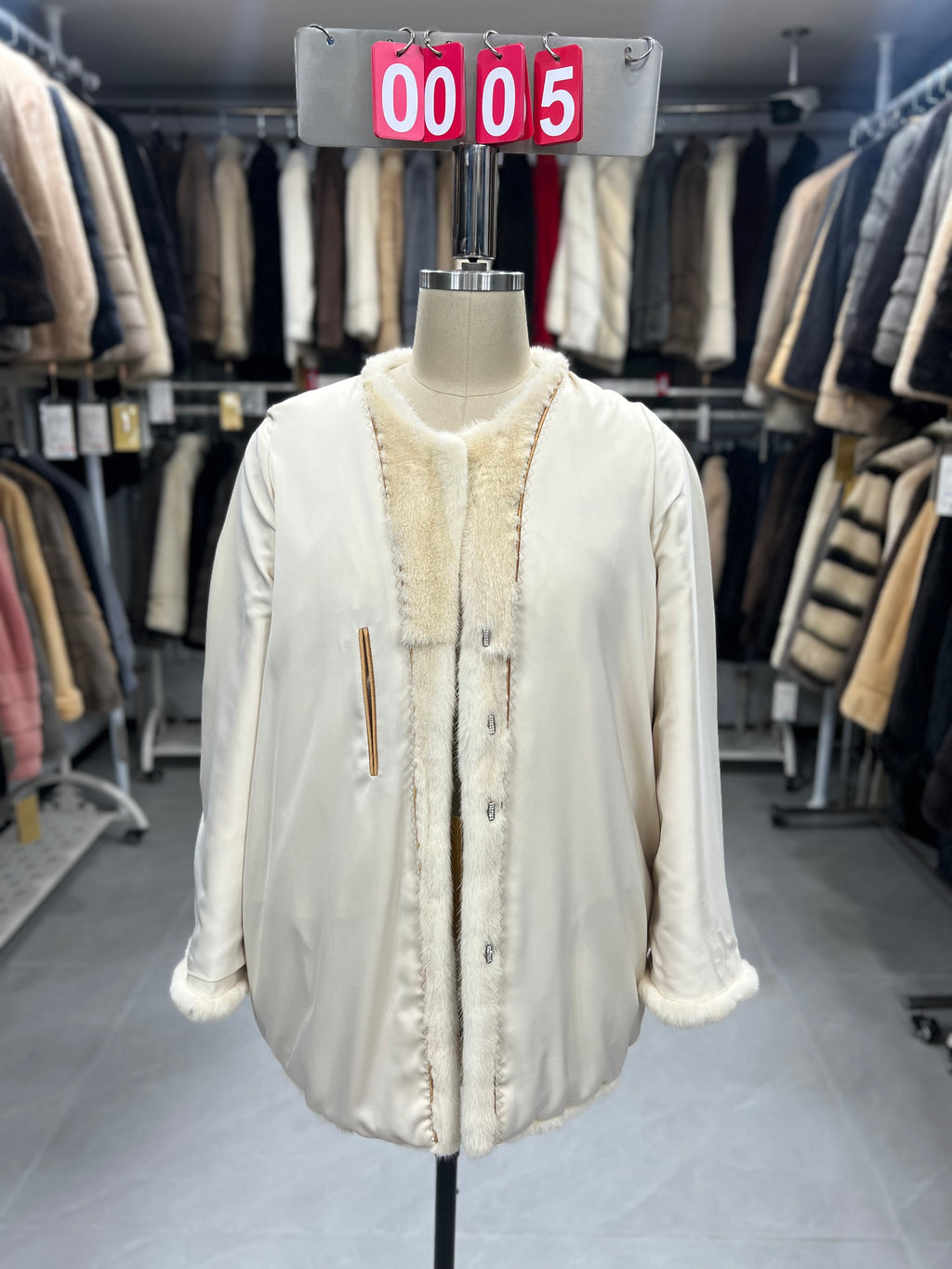 White velvet-finish mink coat with a round-neck design.005