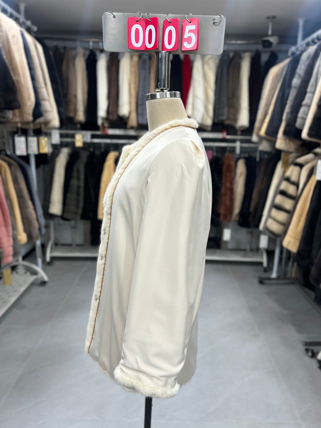 White velvet-finish mink coat with a round-neck design.005