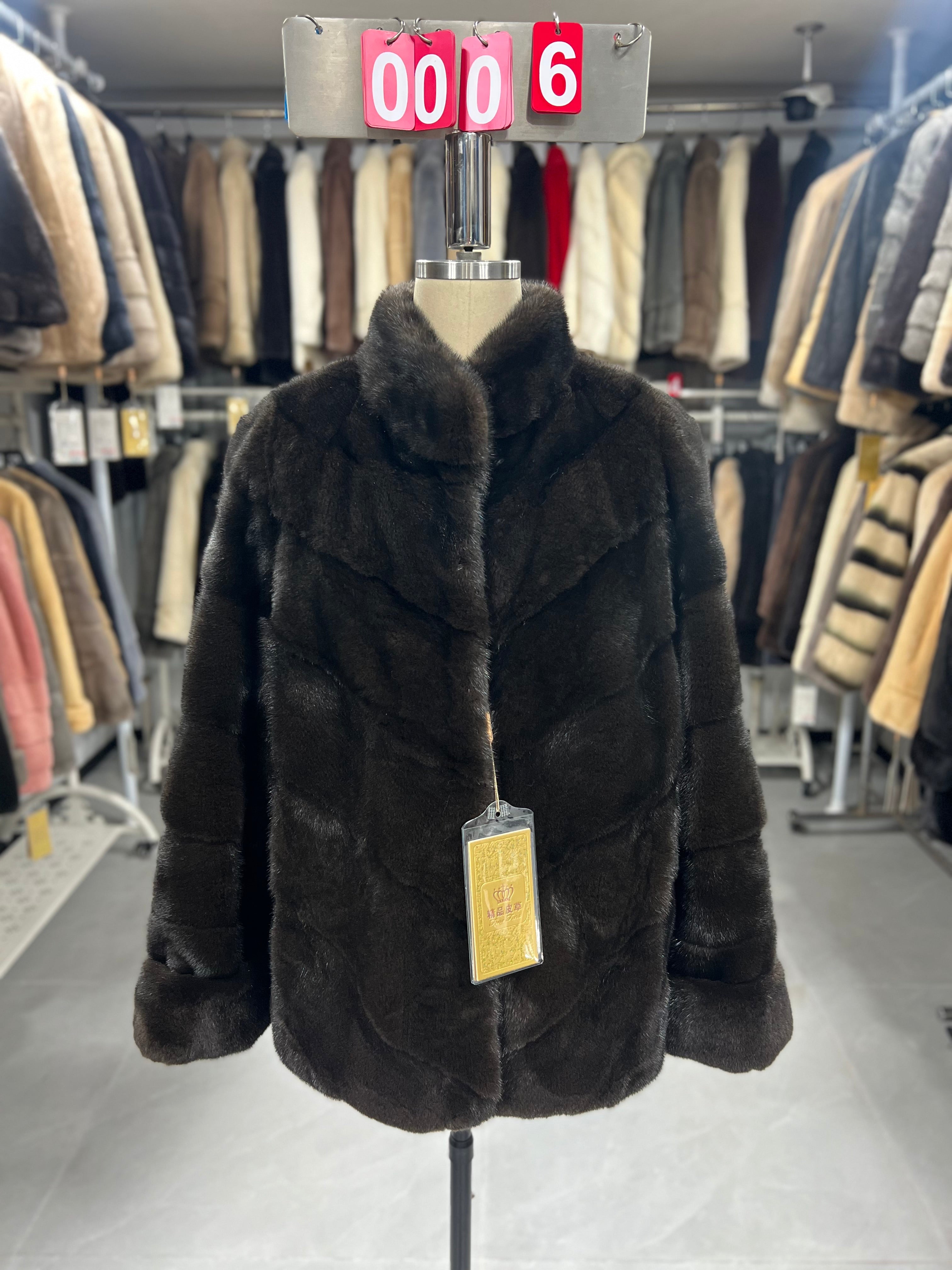 Brown velvet-finish mink coat featuring a stand collar, diagonal buttoning, and roll-up sleeves.006
