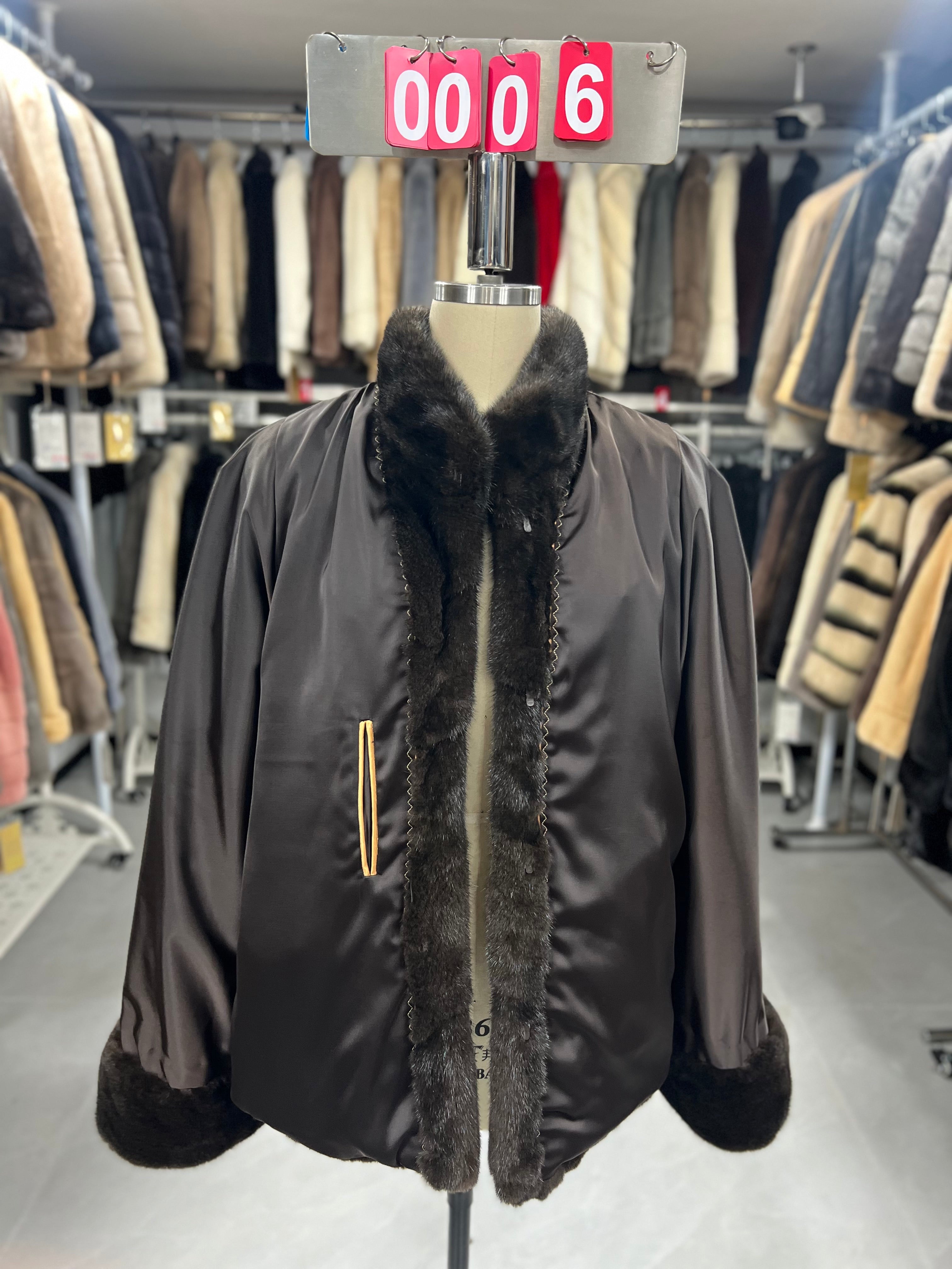 Brown velvet-finish mink coat featuring a stand collar, diagonal buttoning, and roll-up sleeves.006