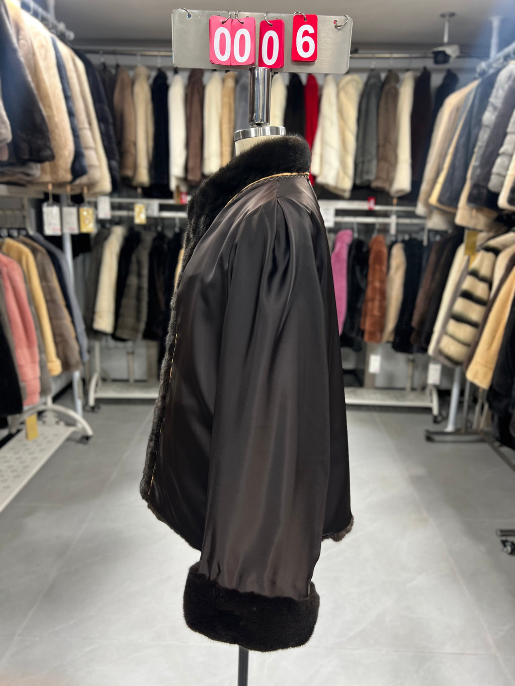 Brown velvet-finish mink coat featuring a stand collar, diagonal buttoning, and roll-up sleeves.006