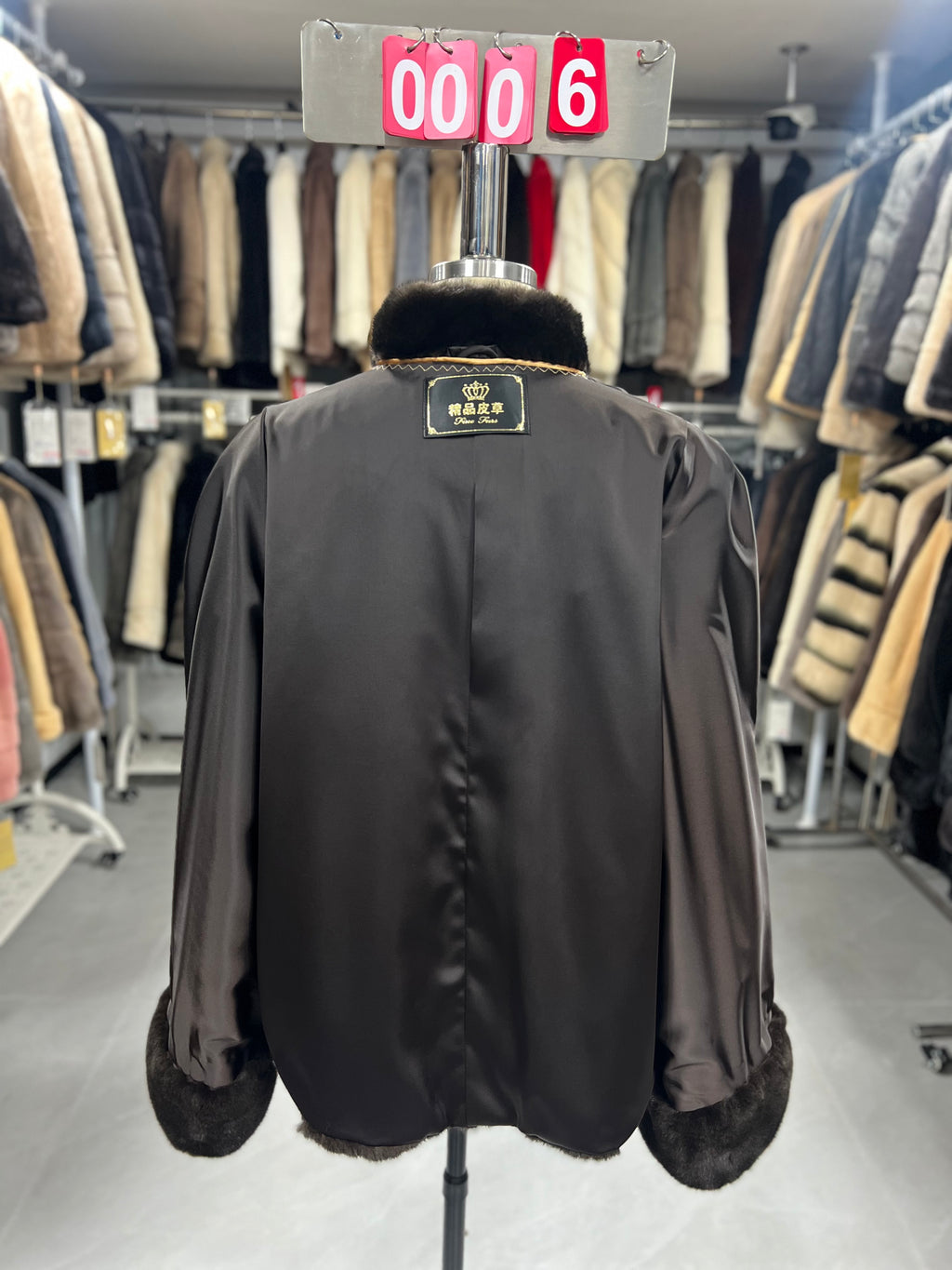 Brown velvet-finish mink coat featuring a stand collar, diagonal buttoning, and roll-up sleeves.006