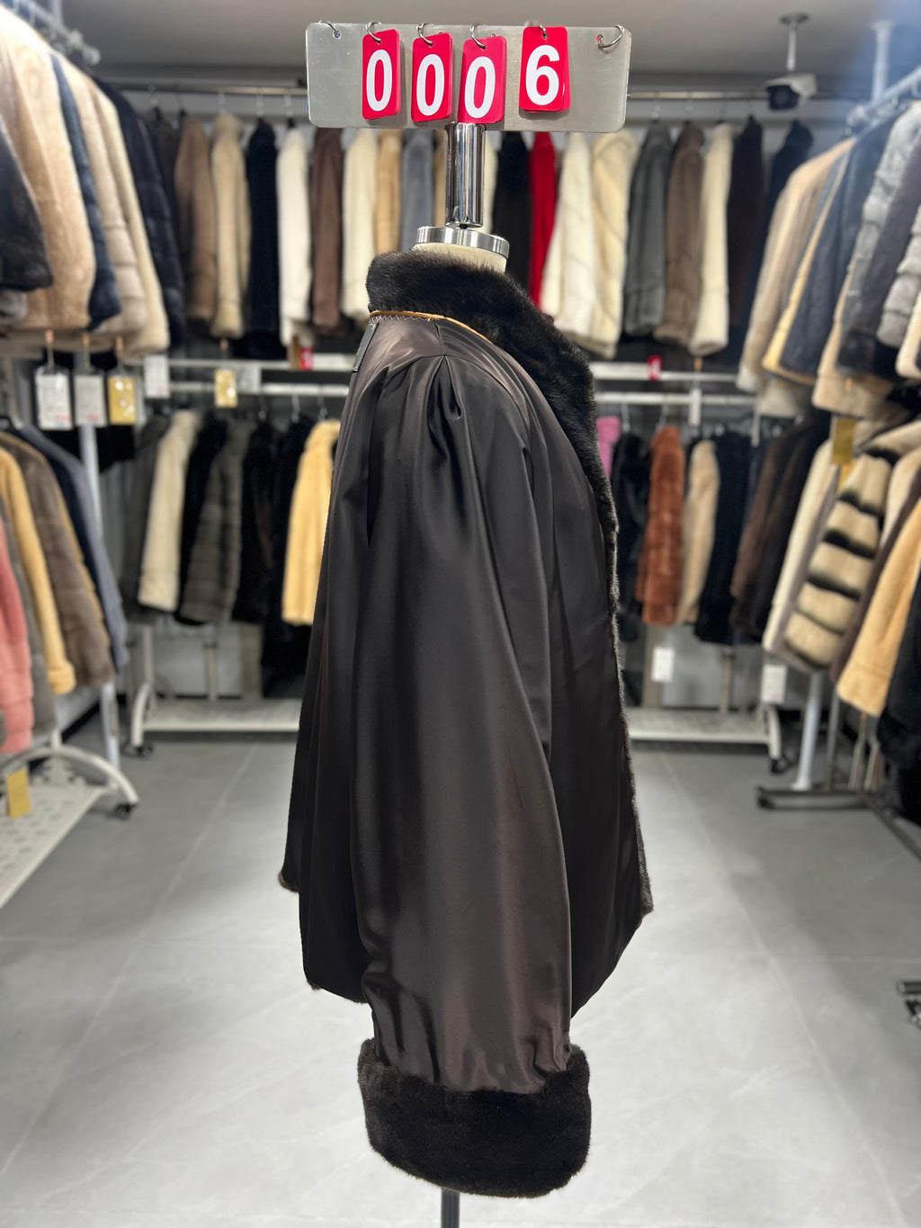 Brown velvet-finish mink coat featuring a stand collar, diagonal buttoning, and roll-up sleeves.006