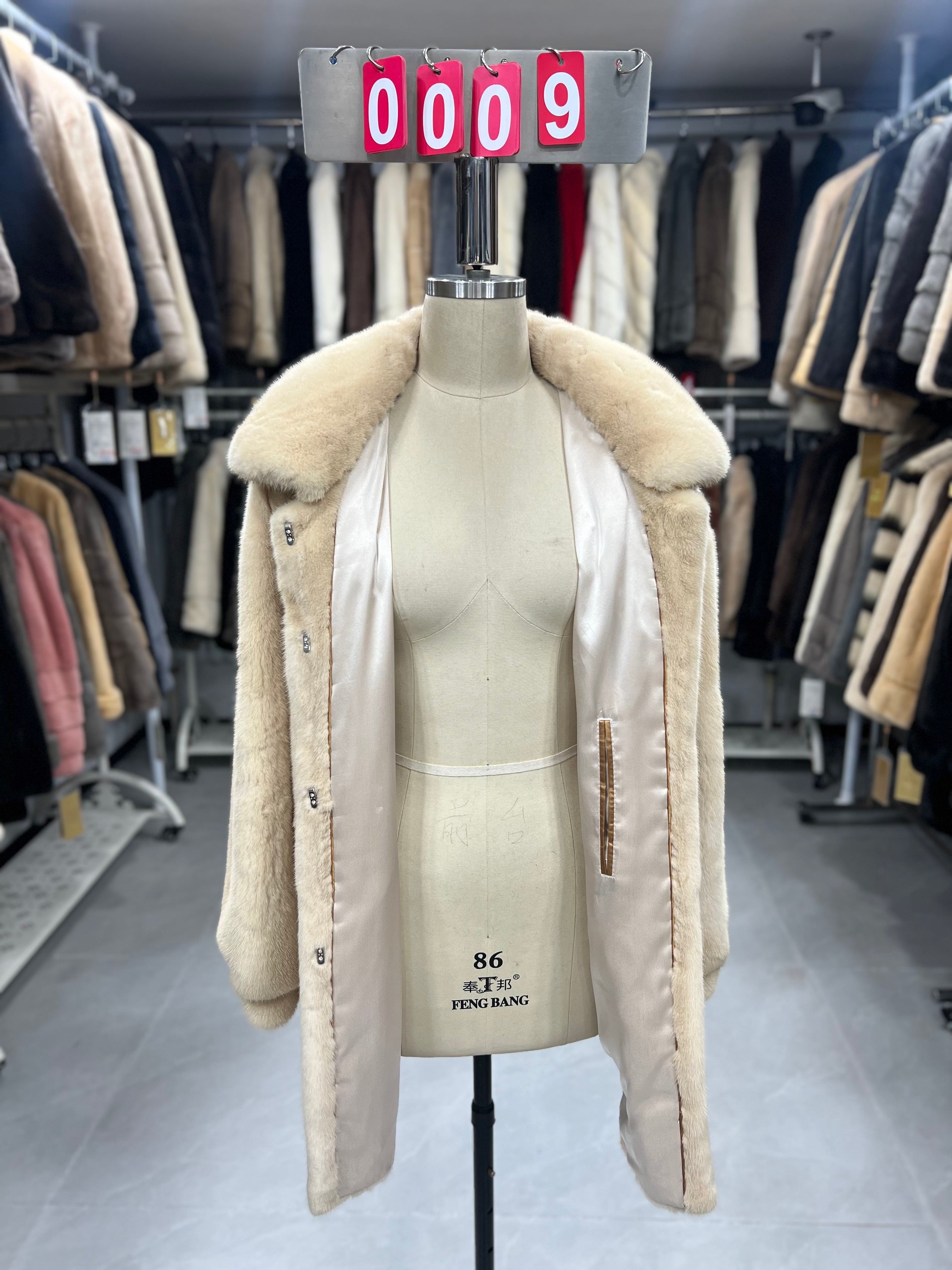 Beige velvet-finish mink coat featuring a lapel collar, horizontal pocket flaps, and vintage-style button detailing.009