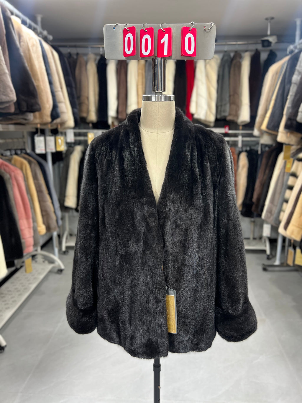 Dark brown V-neck velvet-finish mink coat with roll-up sleeves.010