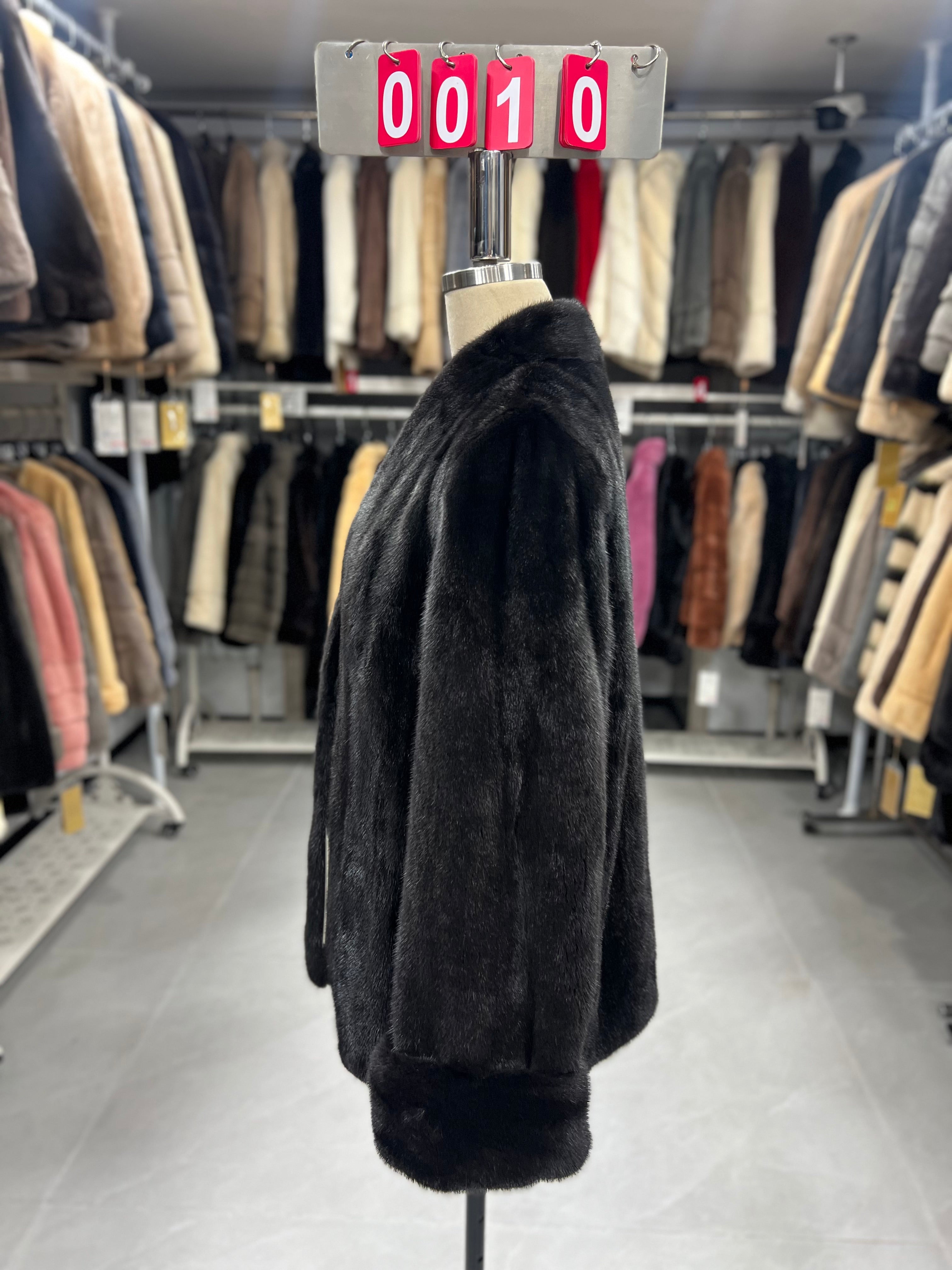 Dark brown V-neck velvet-finish mink coat with roll-up sleeves.010