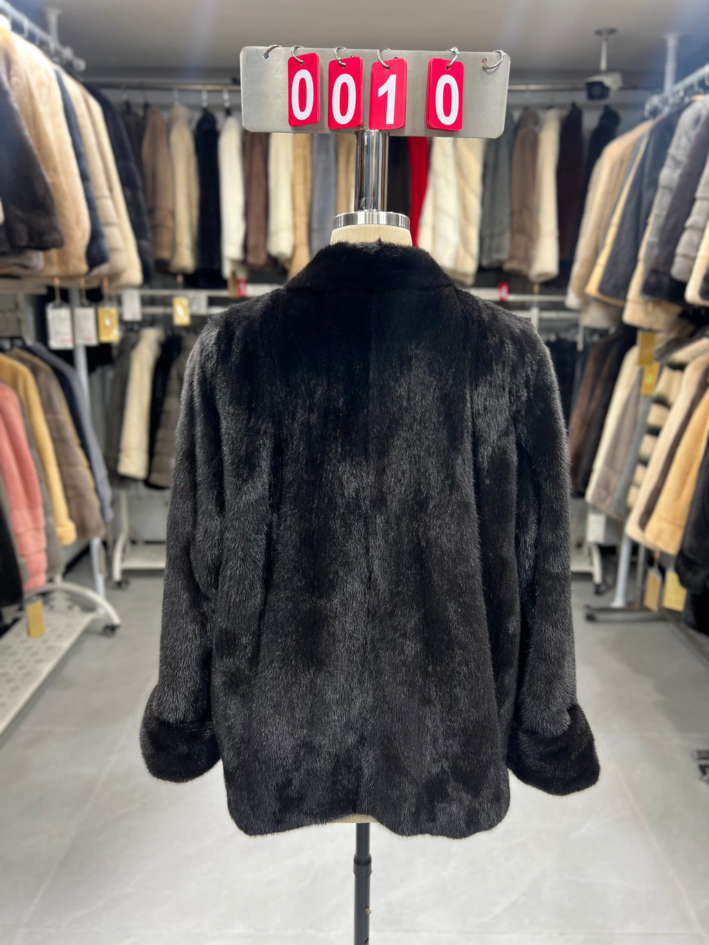 Dark brown V-neck velvet-finish mink coat with roll-up sleeves.010
