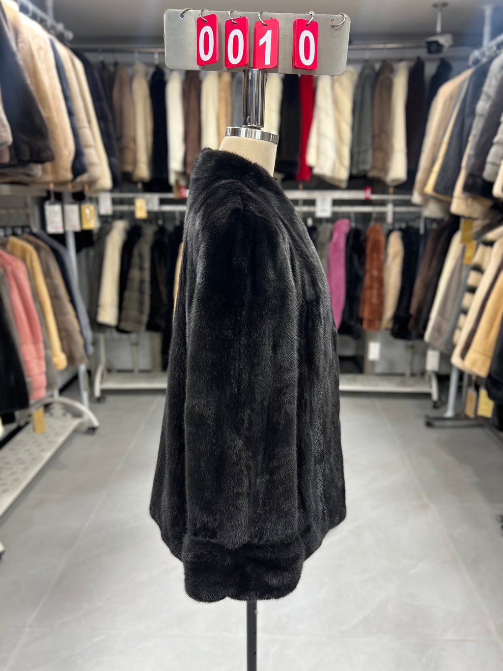 Dark brown V-neck velvet-finish mink coat with roll-up sleeves.010