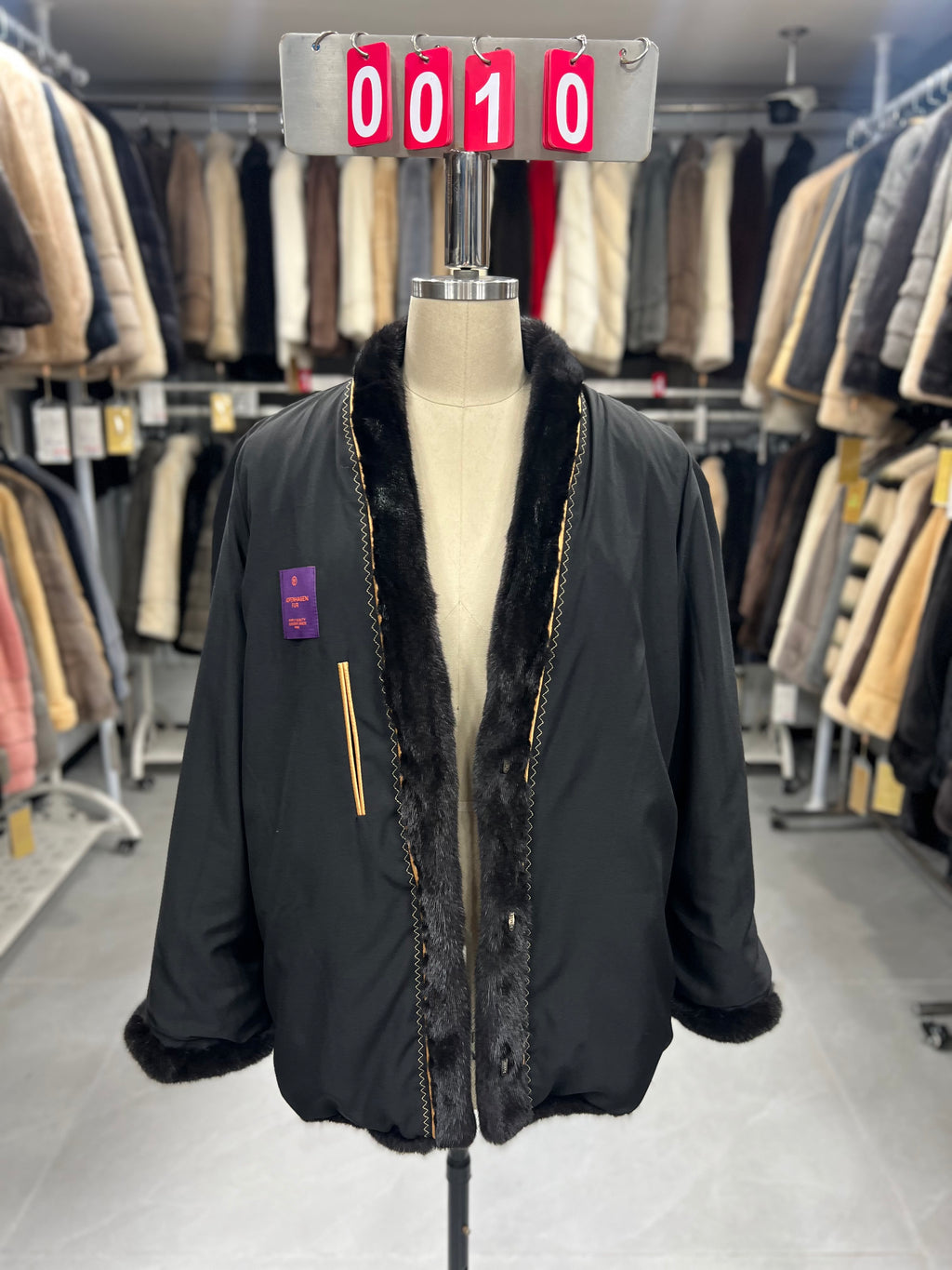 Dark brown V-neck velvet-finish mink coat with roll-up sleeves.010
