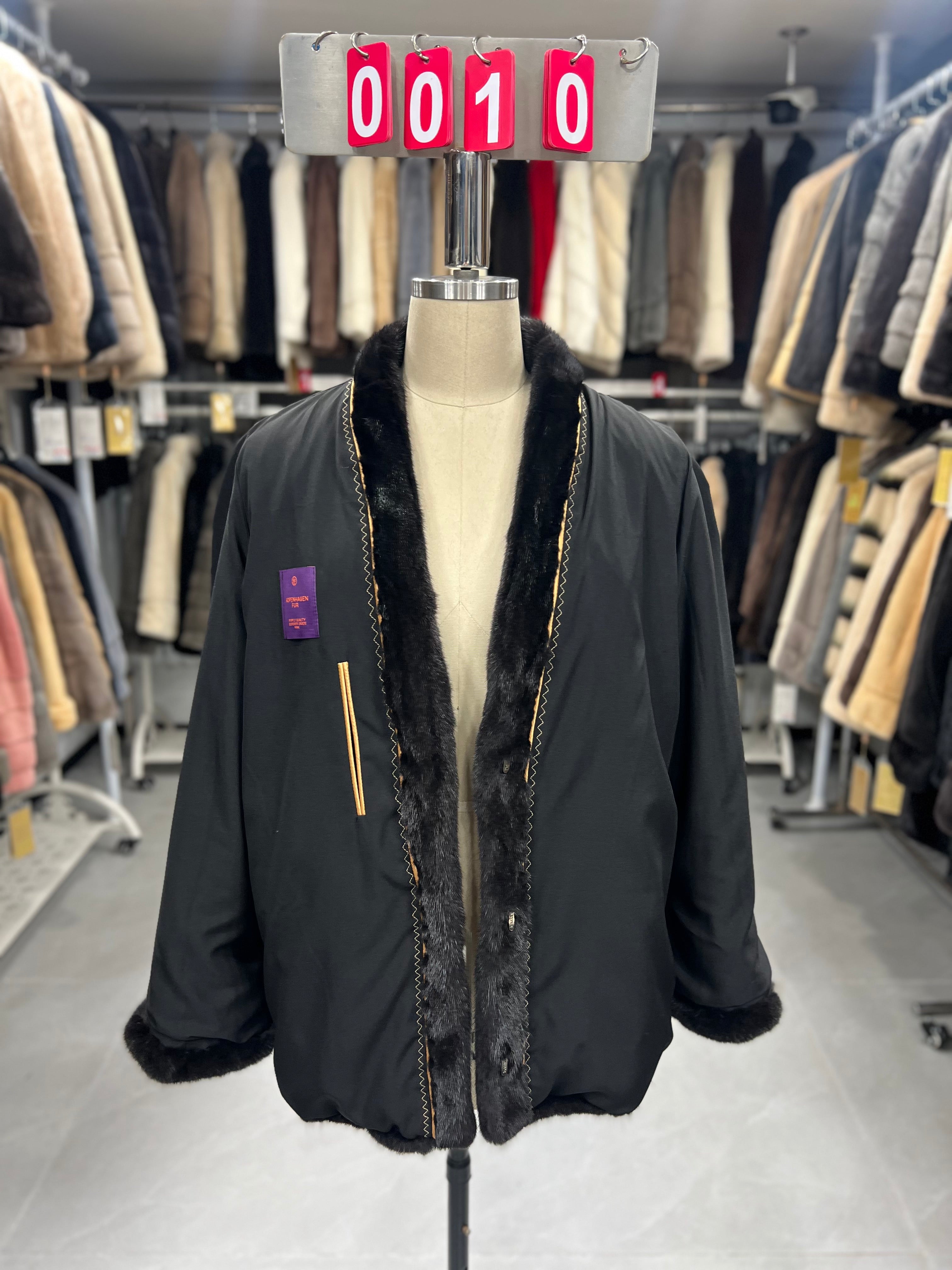 Dark brown V-neck velvet-finish mink coat with roll-up sleeves.010