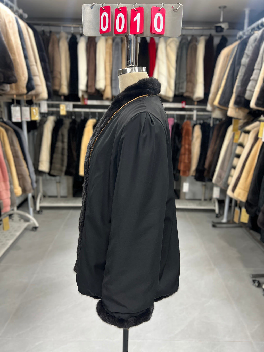 Dark brown V-neck velvet-finish mink coat with roll-up sleeves.010