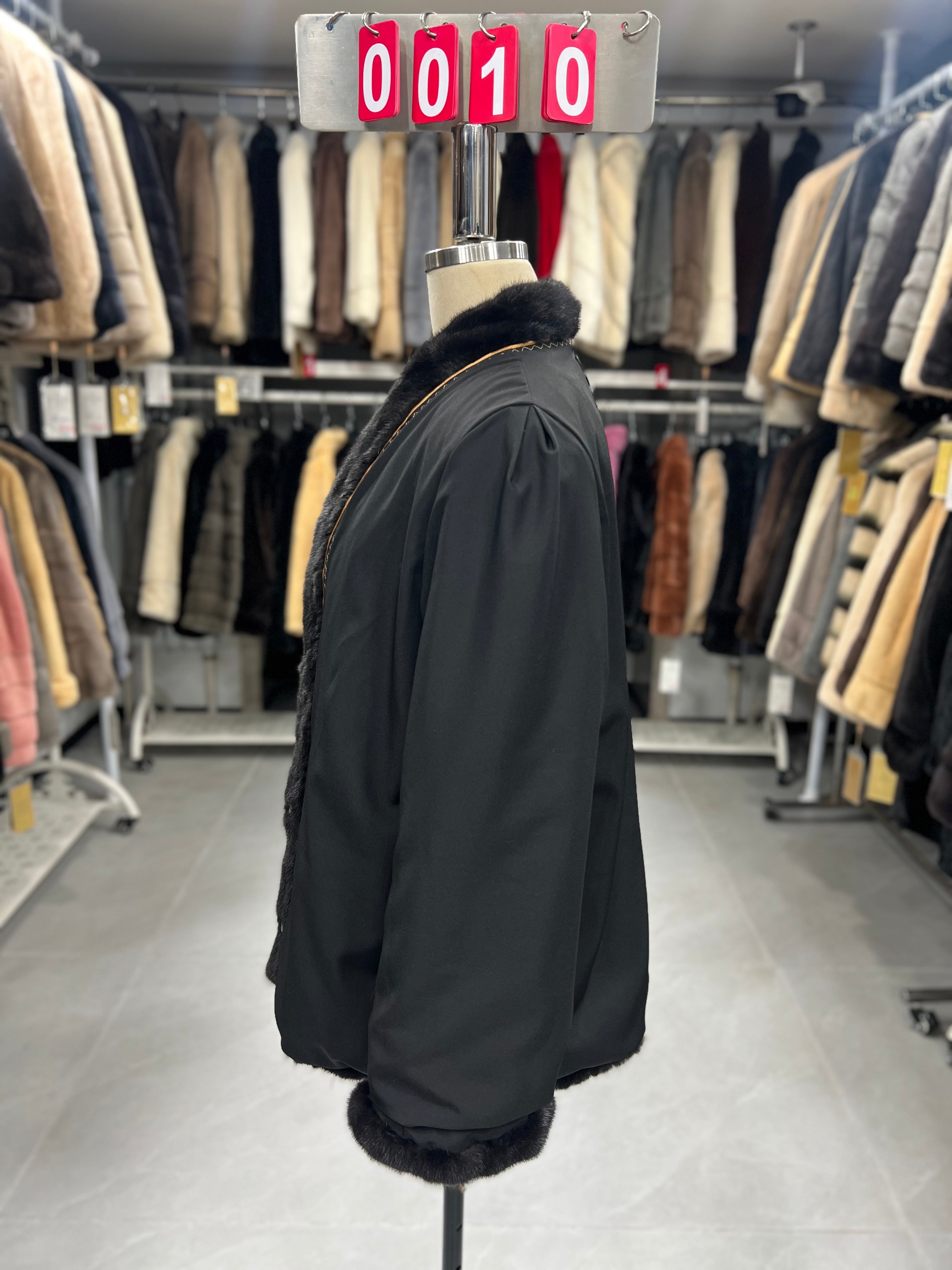 Dark brown V-neck velvet-finish mink coat with roll-up sleeves.010