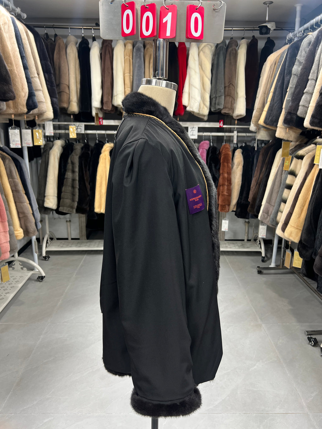 Dark brown V-neck velvet-finish mink coat with roll-up sleeves.010