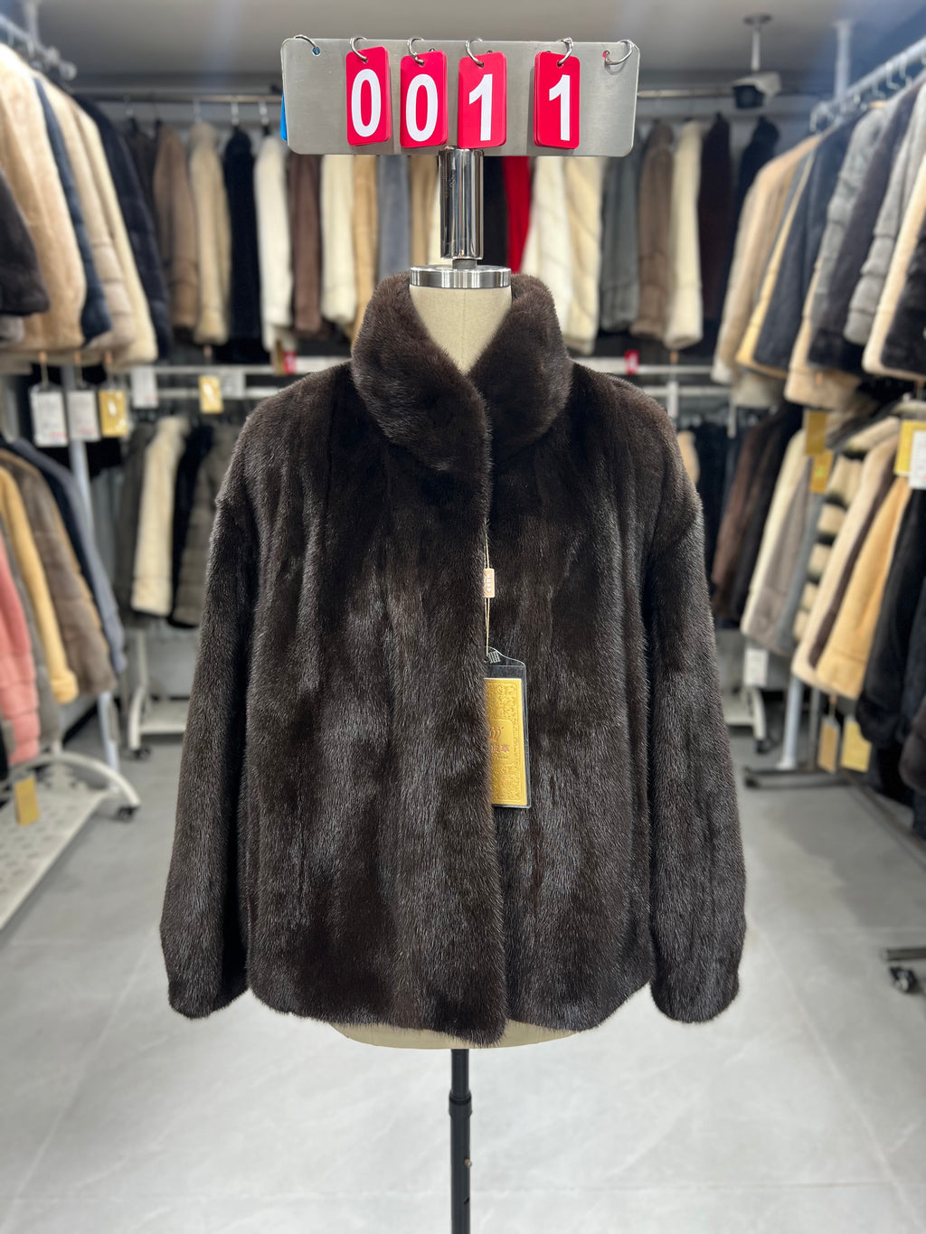 Dark brown velvet-finish mink coat featuring a stand-up collar and fitted cuffs.011