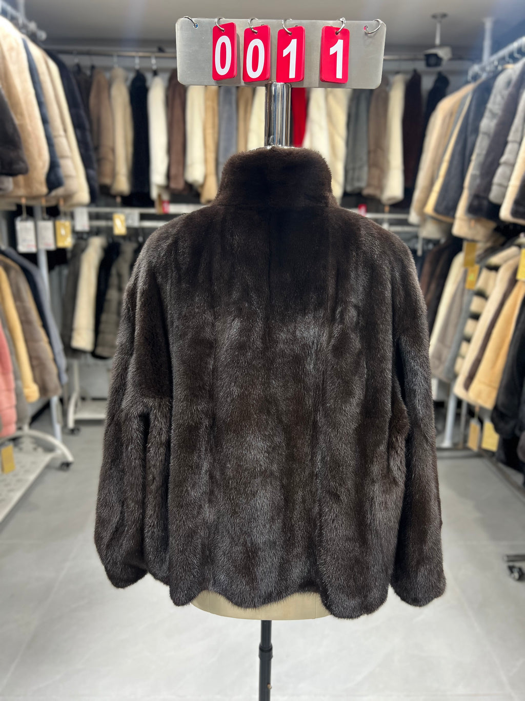 Dark brown velvet-finish mink coat featuring a stand-up collar and fitted cuffs.011