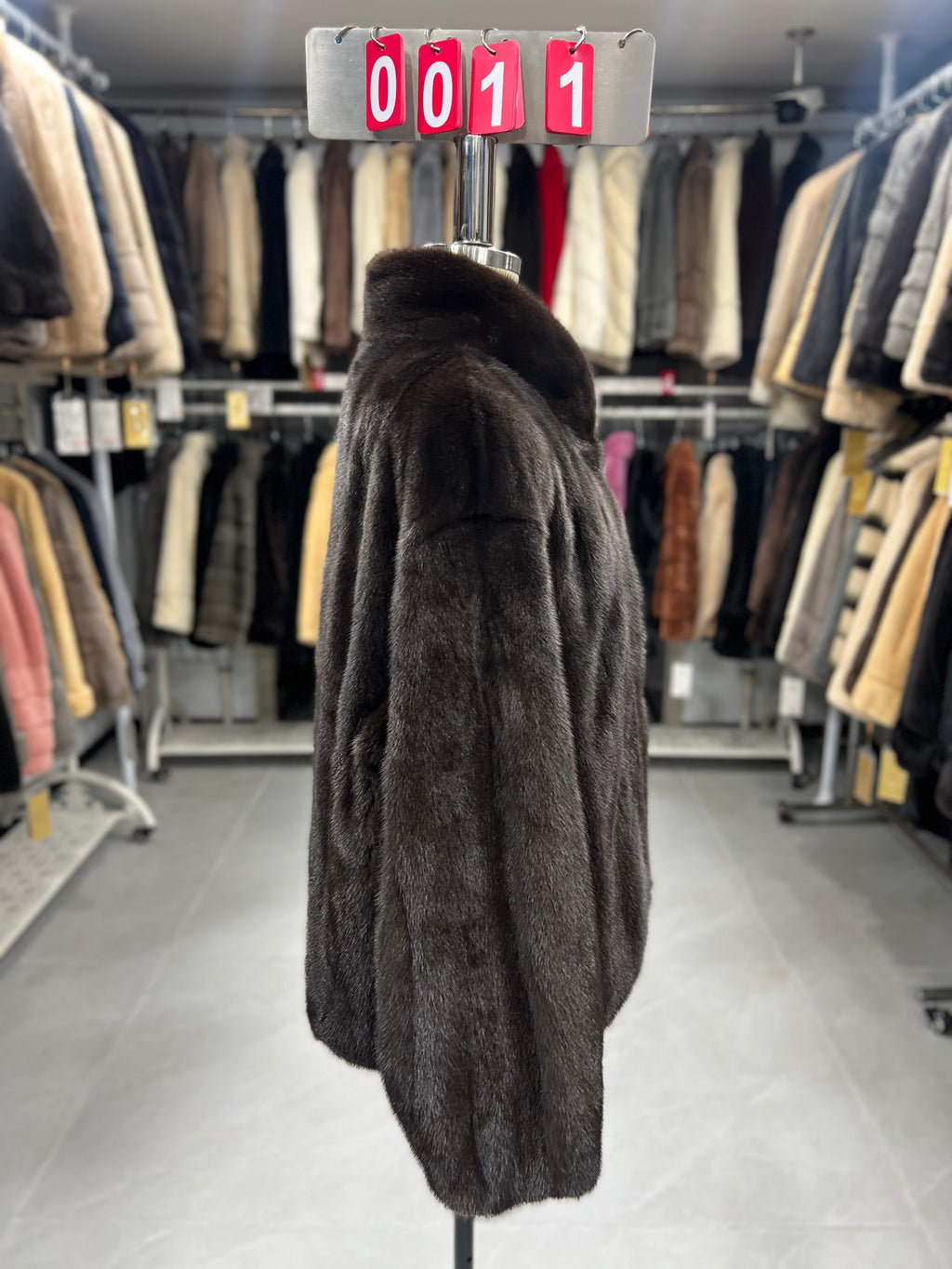 Dark brown velvet-finish mink coat featuring a stand-up collar and fitted cuffs.011