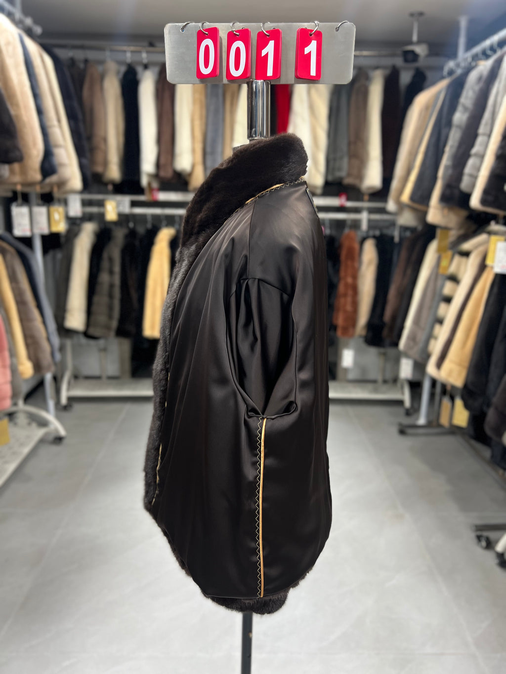 Dark brown velvet-finish mink coat featuring a stand-up collar and fitted cuffs.011