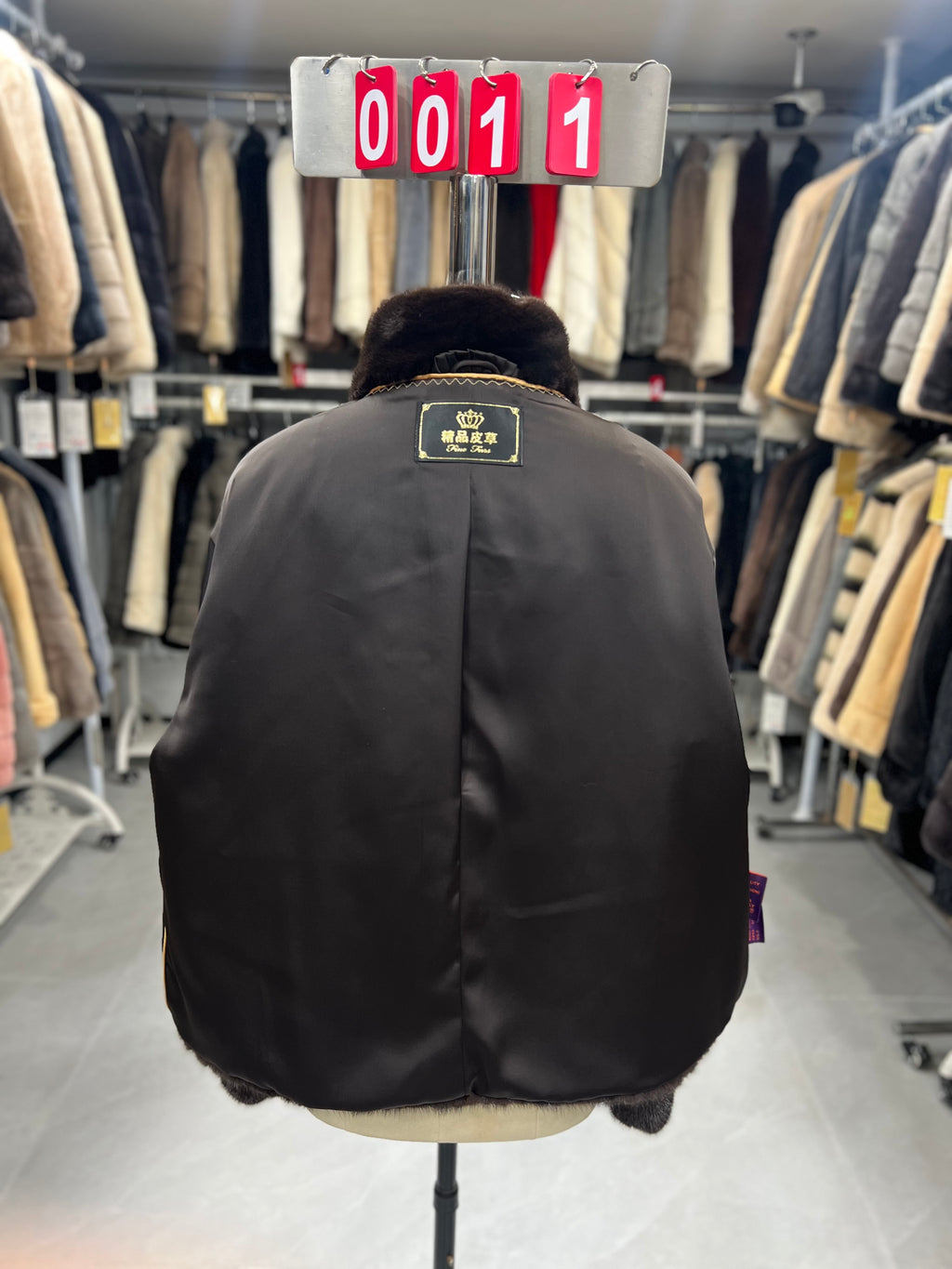 Dark brown velvet-finish mink coat featuring a stand-up collar and fitted cuffs.011