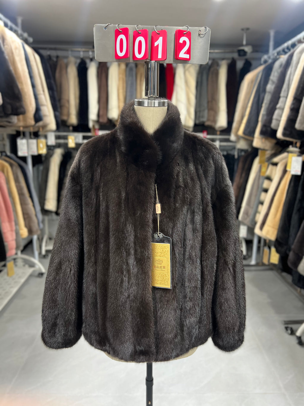 Dark brown velvet-finish mink coat featuring a stand-up collar and fitted cuffs.012