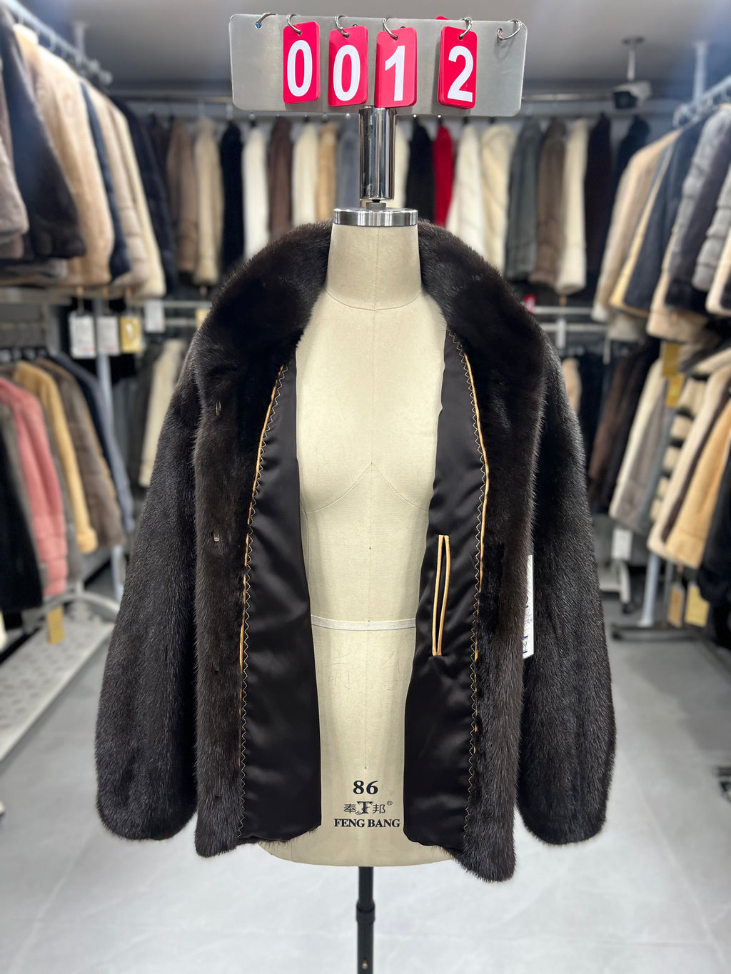 Dark brown velvet-finish mink coat featuring a stand-up collar and fitted cuffs.012