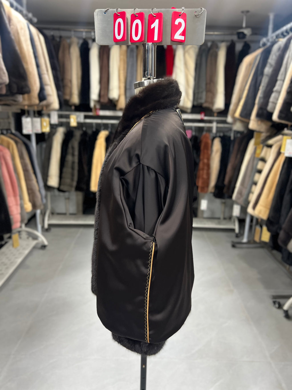 Dark brown velvet-finish mink coat featuring a stand-up collar and fitted cuffs.012