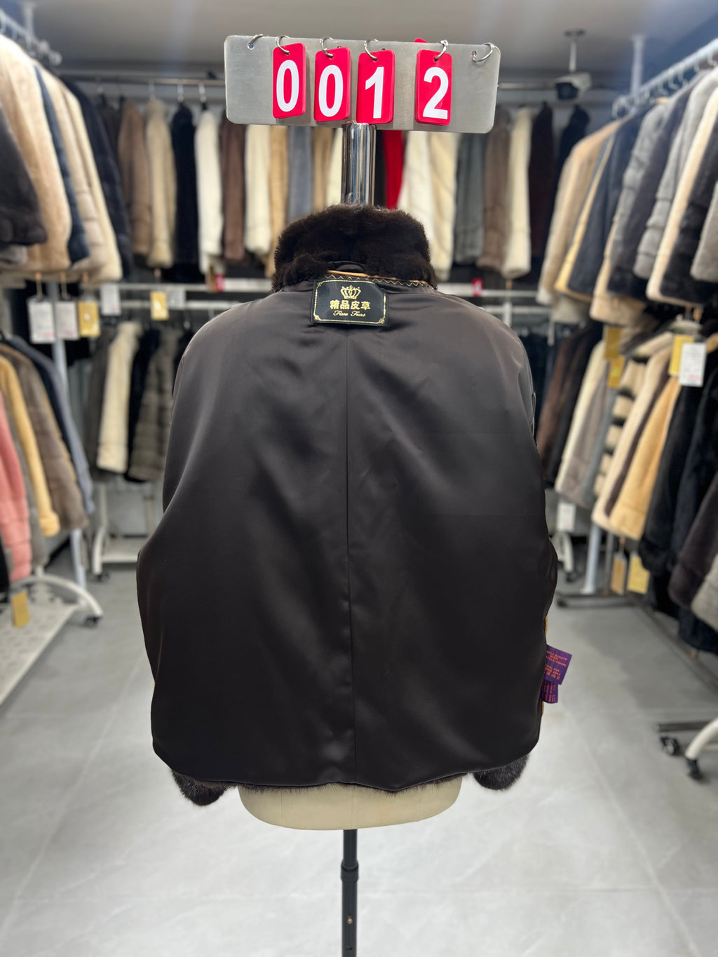Dark brown velvet-finish mink coat featuring a stand-up collar and fitted cuffs.012