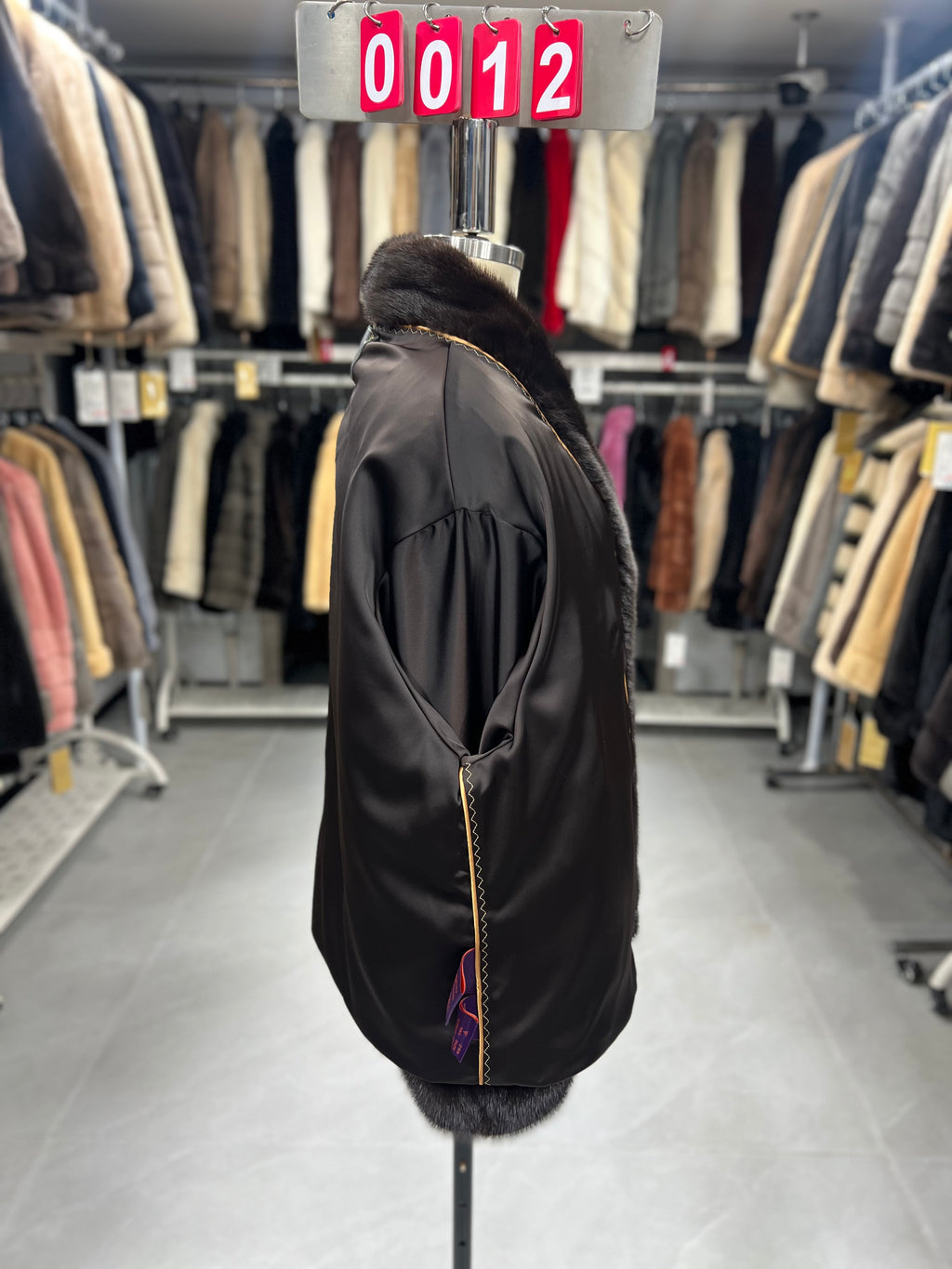 Dark brown velvet-finish mink coat featuring a stand-up collar and fitted cuffs.012