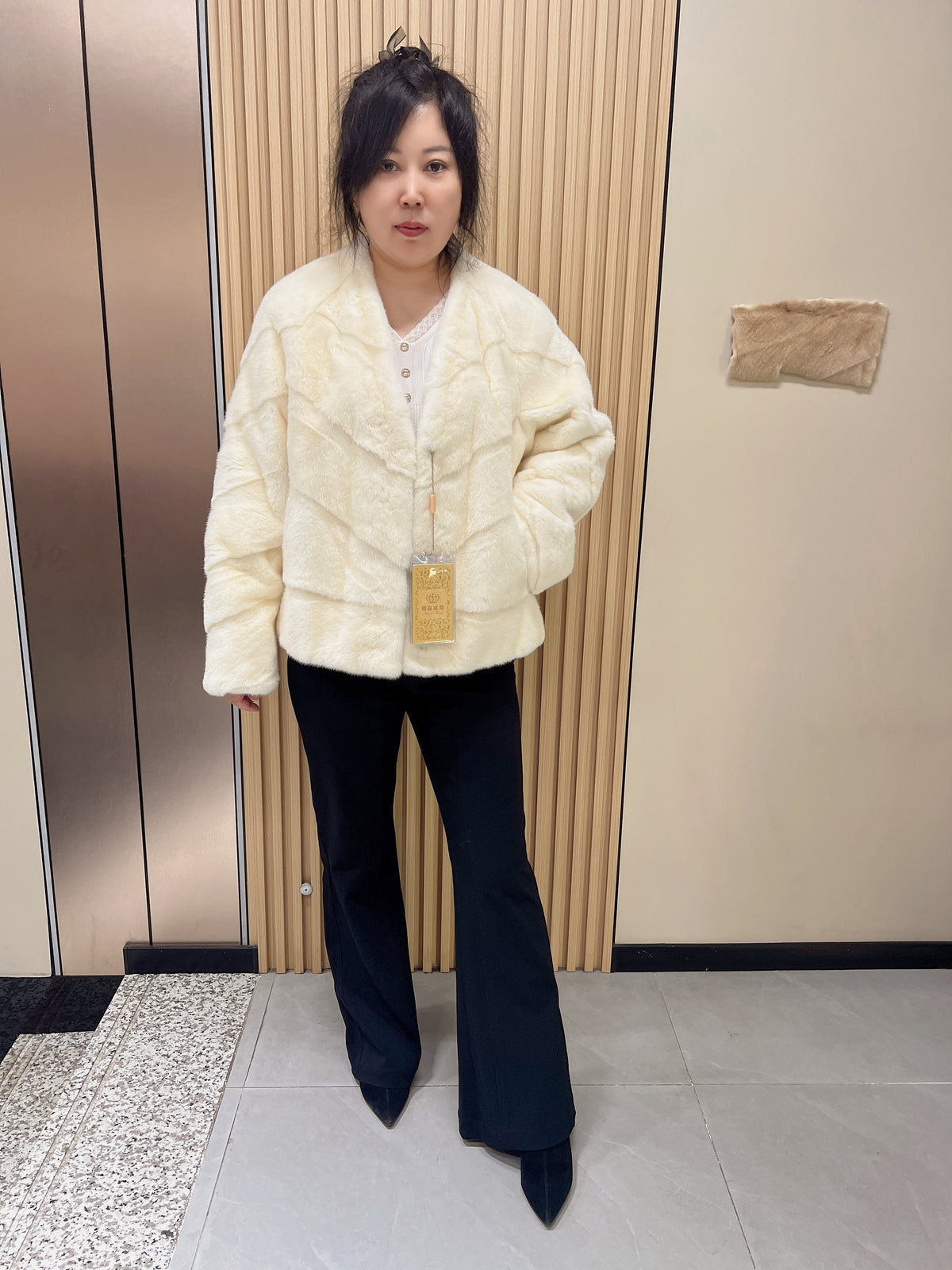 No. 153 Off-white V-neck mink fur coat featuring diagonal detailing.
