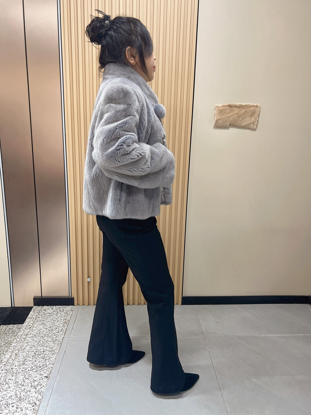 No. 162: Grey mink fur coat with a stand-up collar and pom-pom embellishments at the neckline.