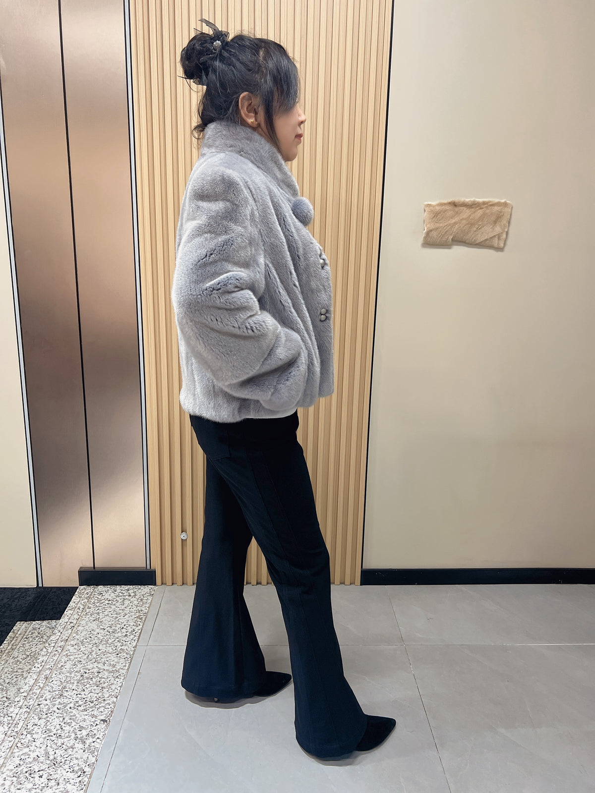 No. 162: Grey mink fur coat with a stand-up collar and pom-pom embellishments at the neckline.
