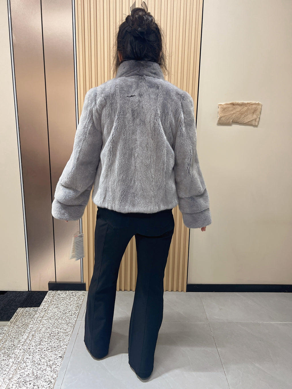 No. 162: Grey mink fur coat with a stand-up collar and pom-pom embellishments at the neckline.