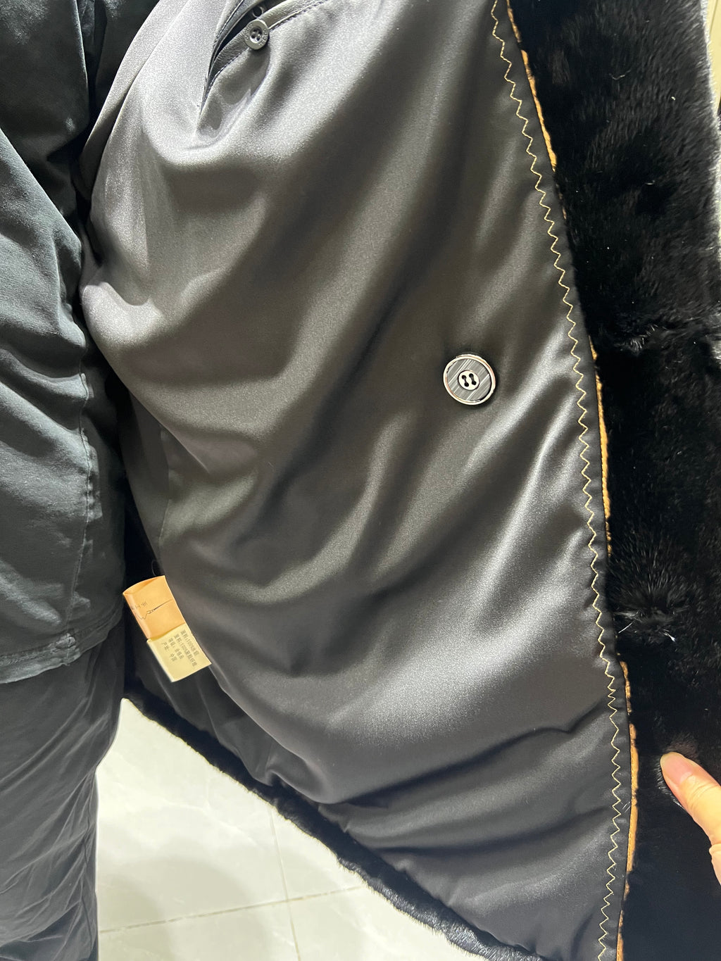 No. 124 Men's black mink coat featuring a button-front design and a suit-style lapel.