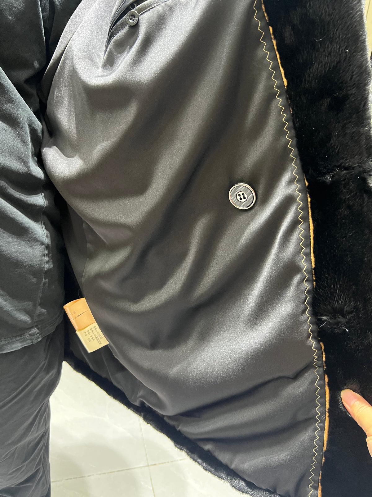 No. 124 Men's black mink coat featuring a button-front design and a suit-style lapel.