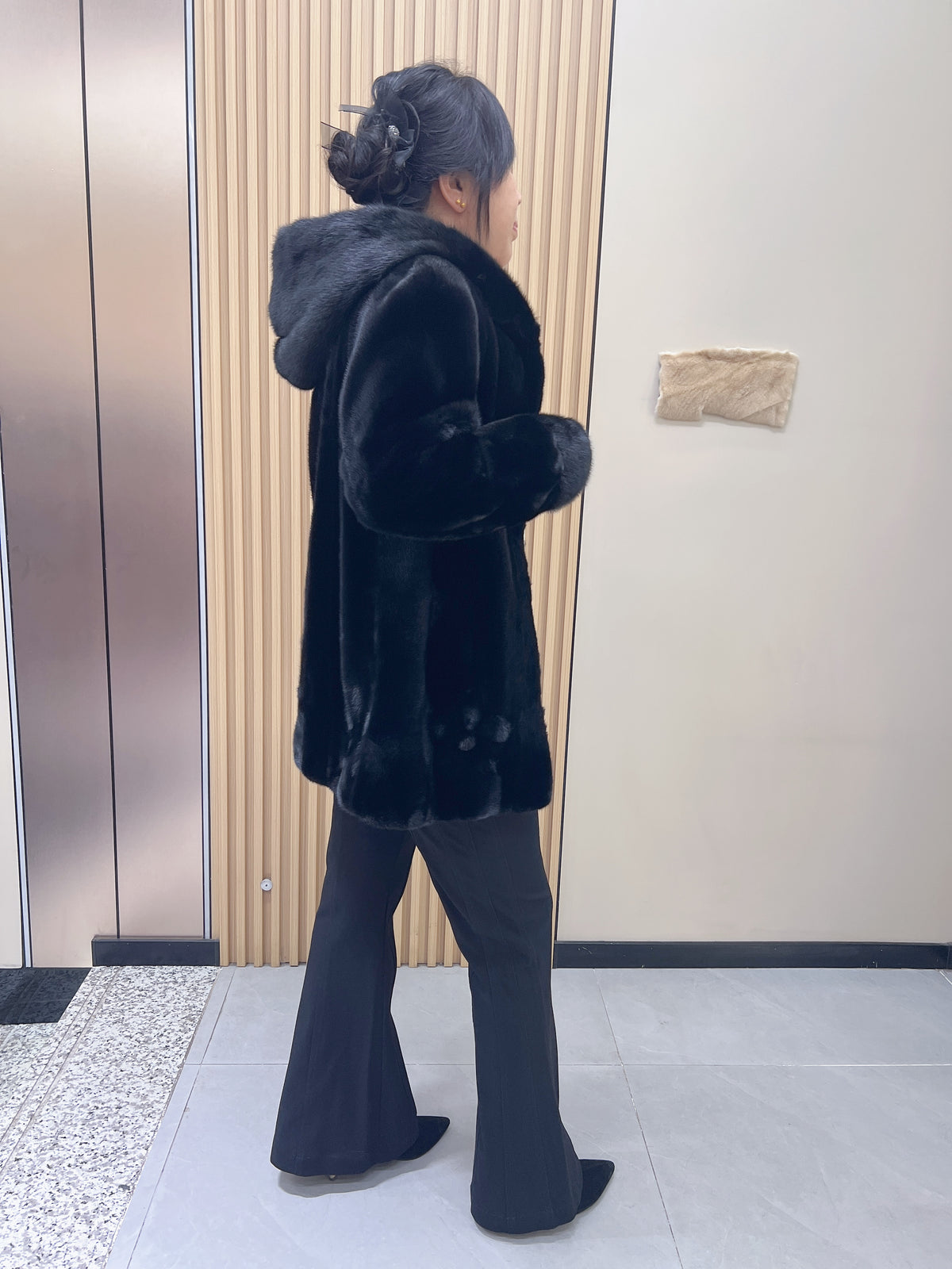 No. 194 black hooded mink fur coat, featuring a petal-shaped hem design.