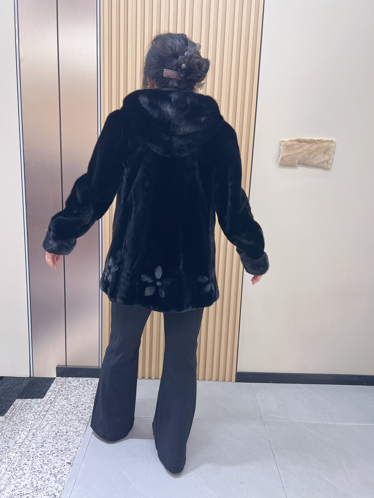 No. 194 black hooded mink fur coat, featuring a petal-shaped hem design.