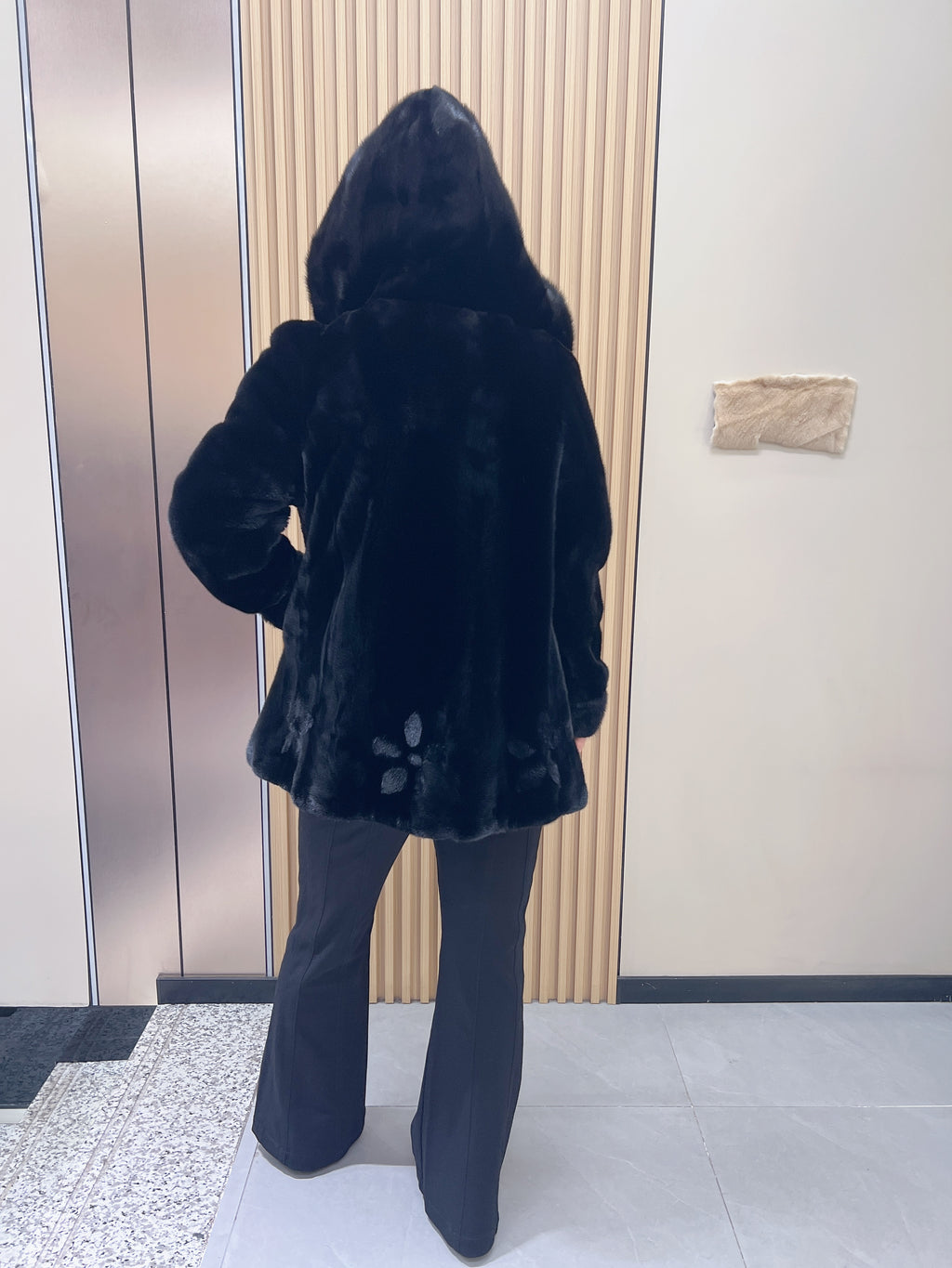 No. 194 black hooded mink fur coat, featuring a petal-shaped hem design.