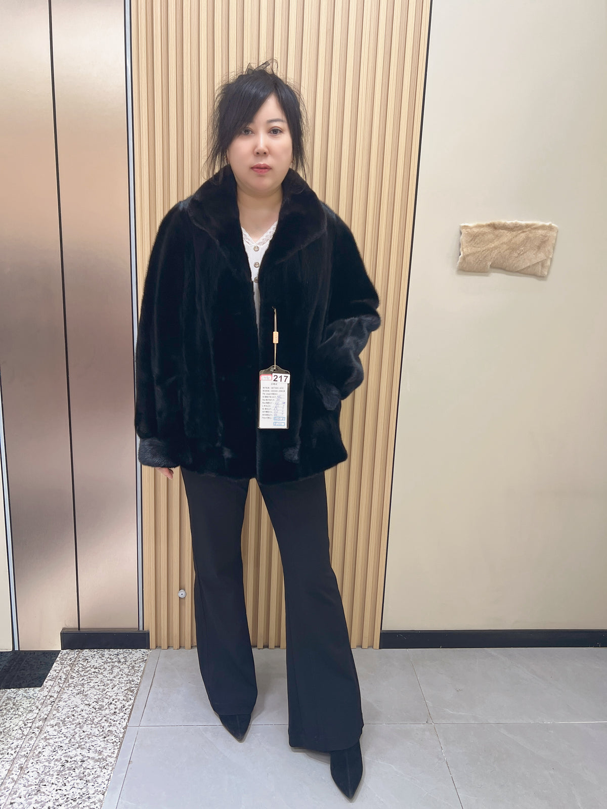 No. 217 black mink fur coat with a convertible stand-up collar.