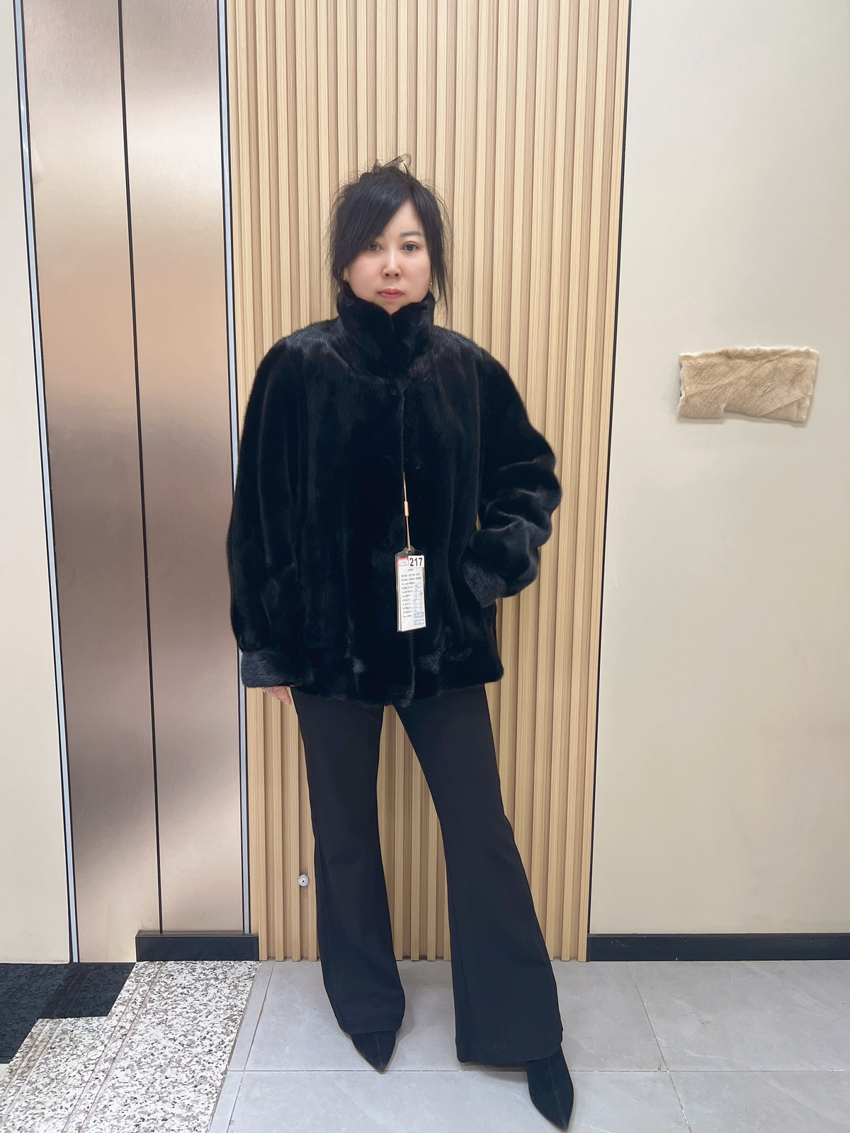 No. 217 black mink fur coat with a convertible stand-up collar.