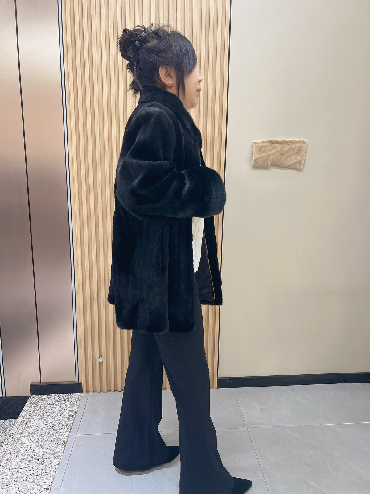 No. 216 black mink fur coat, featuring a stand collar and turn-back cuffs.