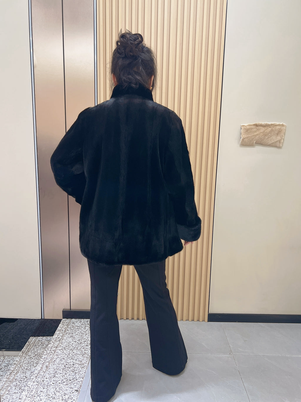 No. 216 black mink fur coat, featuring a stand collar and turn-back cuffs.