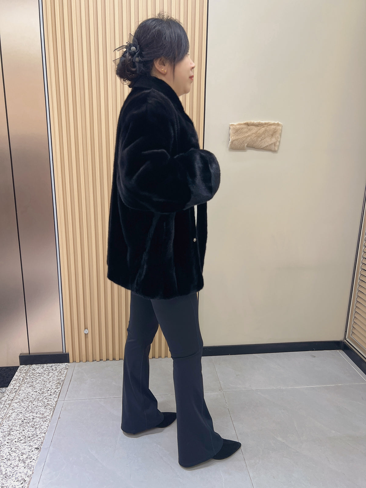 No. 225 black mink fur coat with a stand-up collar and vintage-style bronze-tone buttons.