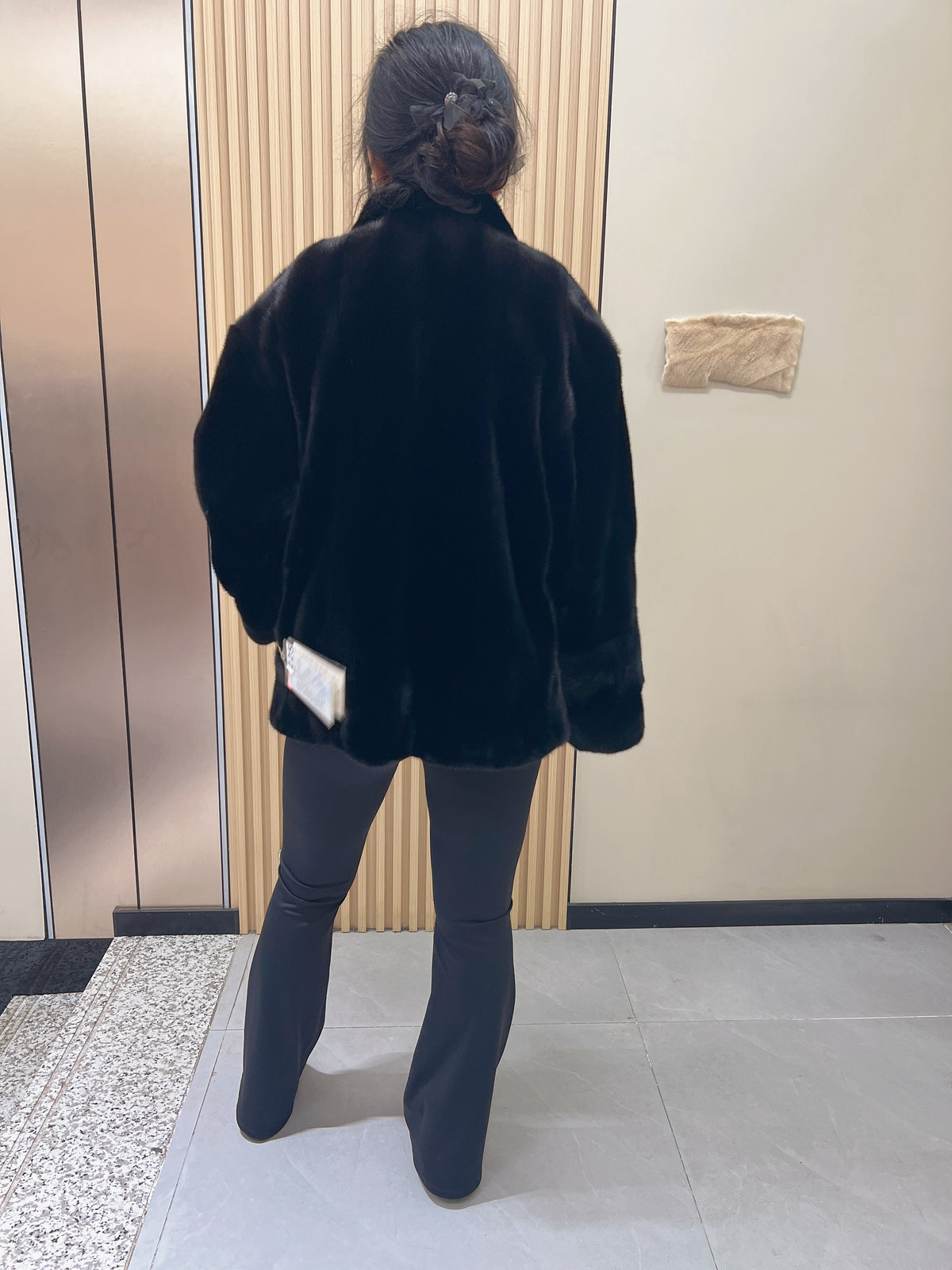 No. 225 black mink fur coat with a stand-up collar and vintage-style bronze-tone buttons.
