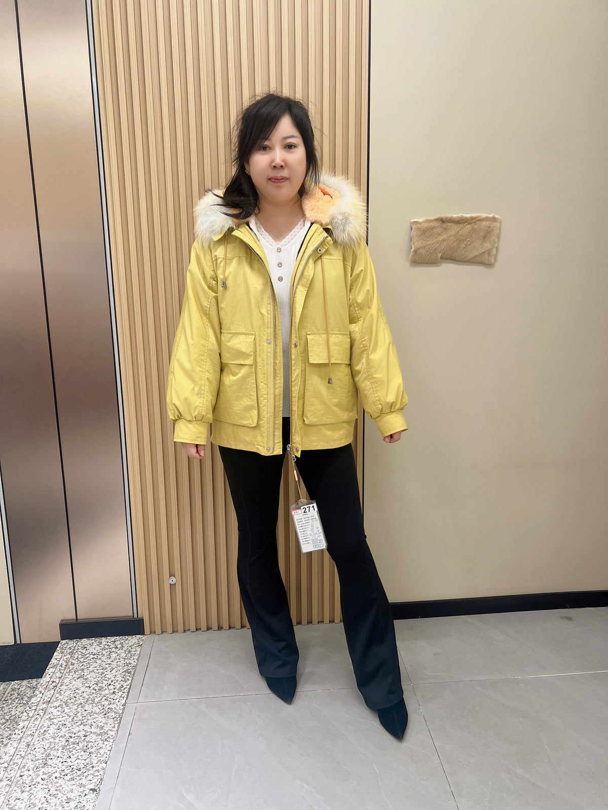 No. 271 light yellow parka, featuring a rabbit fur lining, a hood, and a fox fur collar.