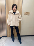 No. 279 Beige faux-fur jacket with a lapel collar and zip fastening.