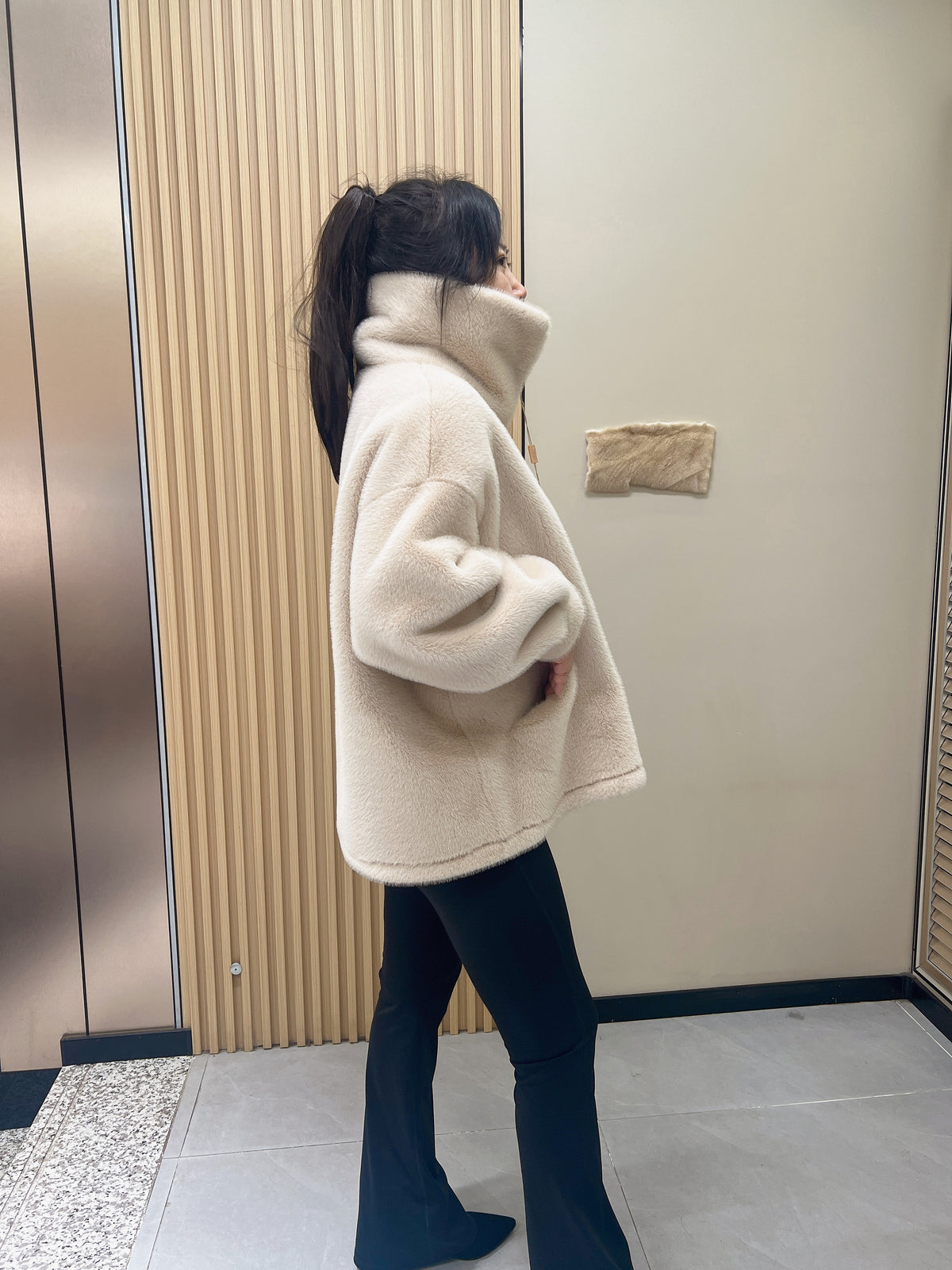 No. 279 Beige faux-fur jacket with a lapel collar and zip fastening.