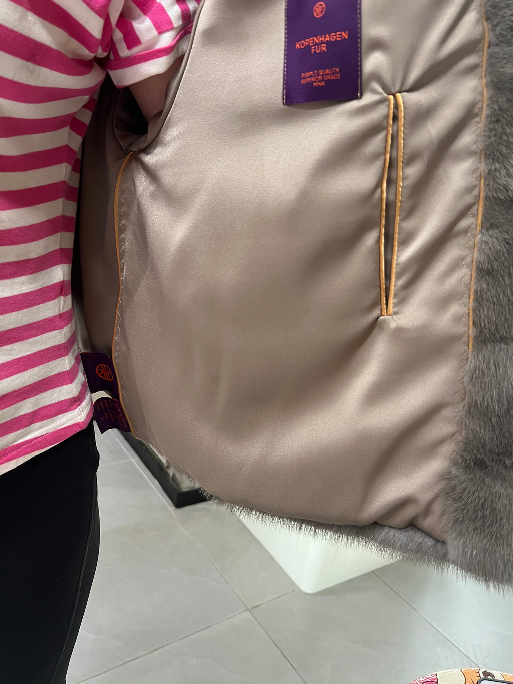 No. 314 Grey hooded mink fur coat with horizontal leather paneling.