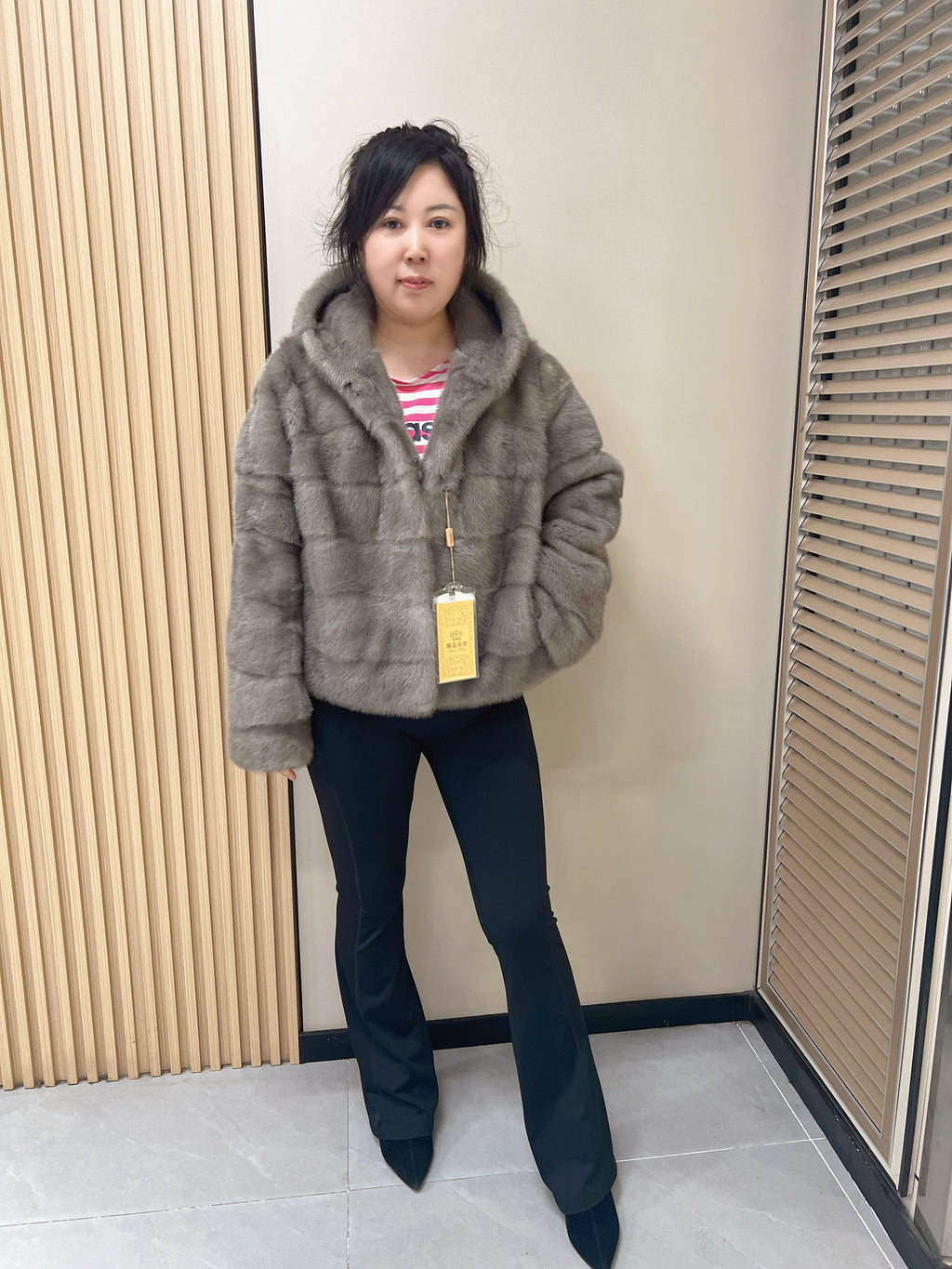 No. 314 Grey hooded mink fur coat with horizontal leather paneling.